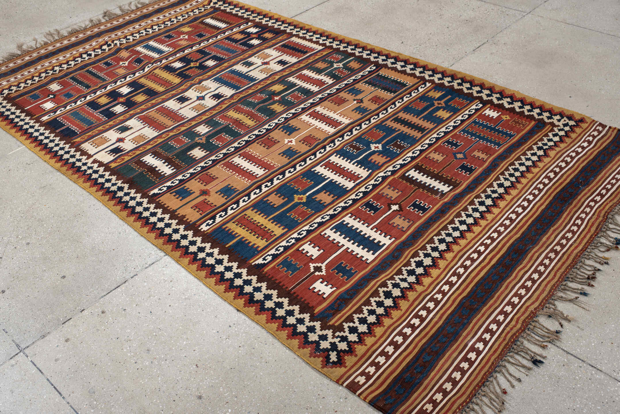 5' x 9' one-of-a-kind handmade vintage Kilim medium size rug. Color palette: rust, ivory, indigo, camel, teal, brown, navy