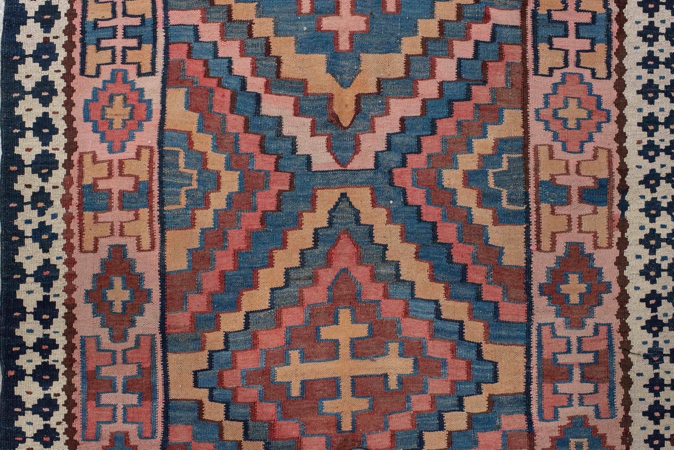 5' x 14' one-of-a-kind handmade vintage Kilim runner rug. Color palette: rose, indigo, ivory, rust, teal, camel, charcoal