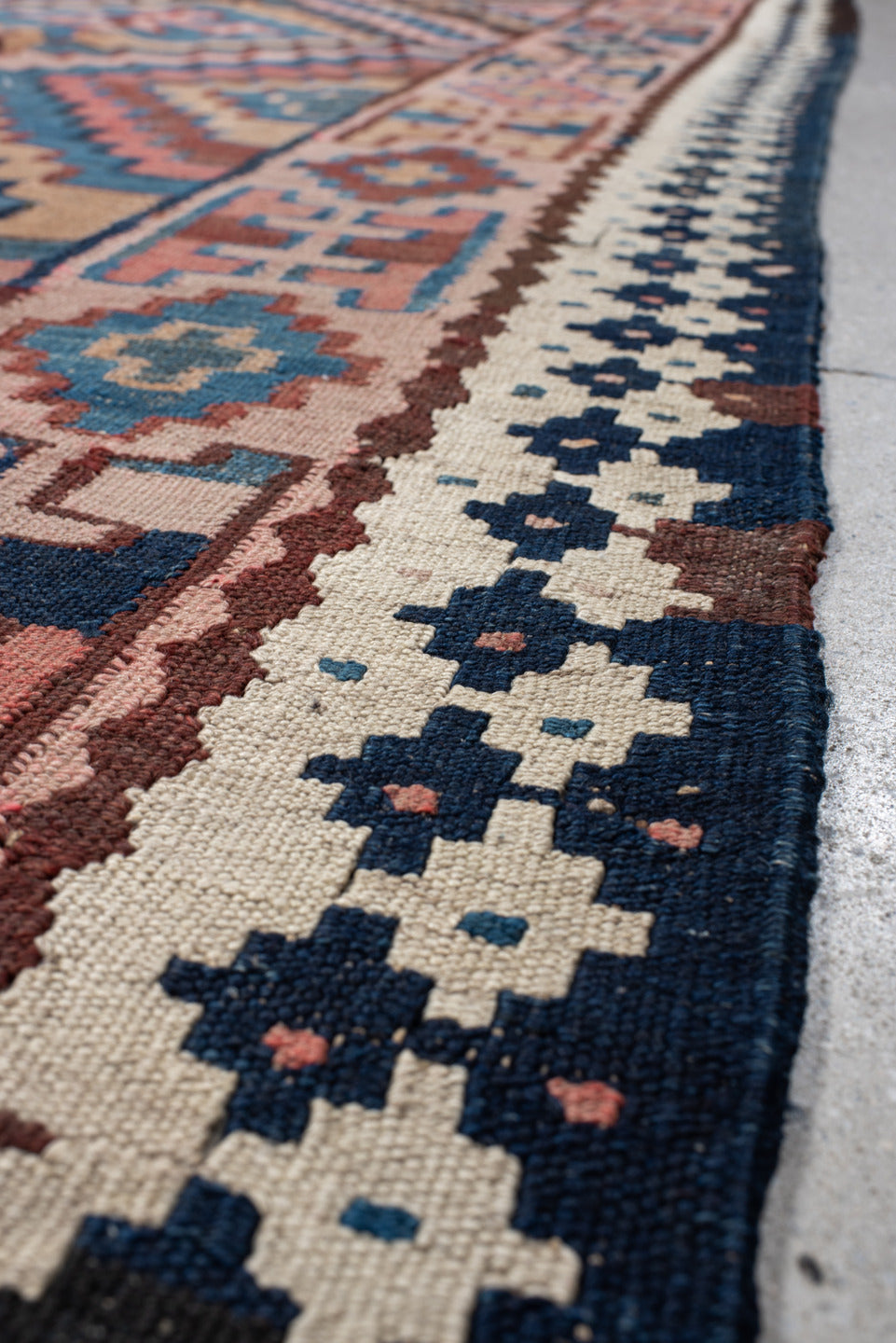 5' x 14' one-of-a-kind handmade vintage Kilim runner rug. Color palette: rose, indigo, ivory, rust, teal, camel, charcoal