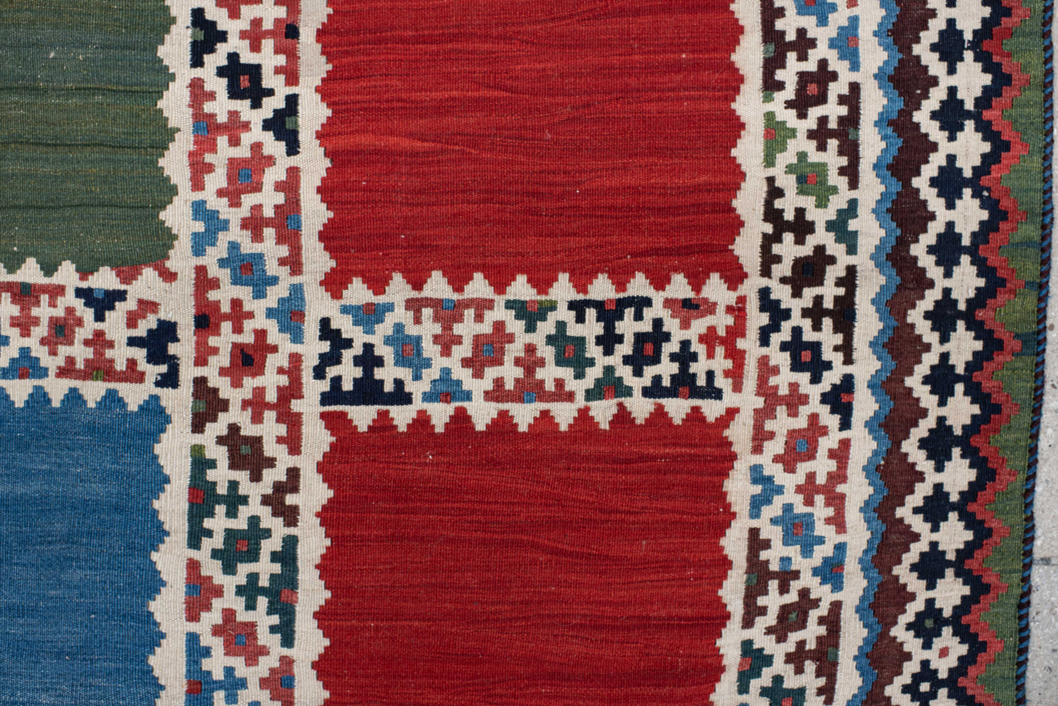 5' x 7' one-of-a-kind handmade vintage Kilim rug. Color palette: rust, ivory, navy, sky_blue, olive, red, teal, brown