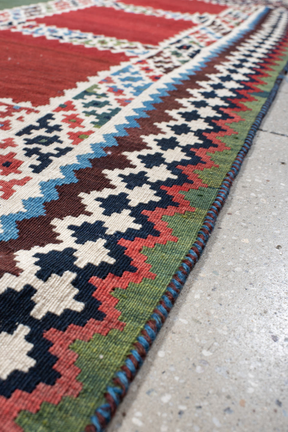 5' x 7' one-of-a-kind handmade vintage Kilim rug. Color palette: rust, ivory, navy, sky_blue, olive, red, teal, brown