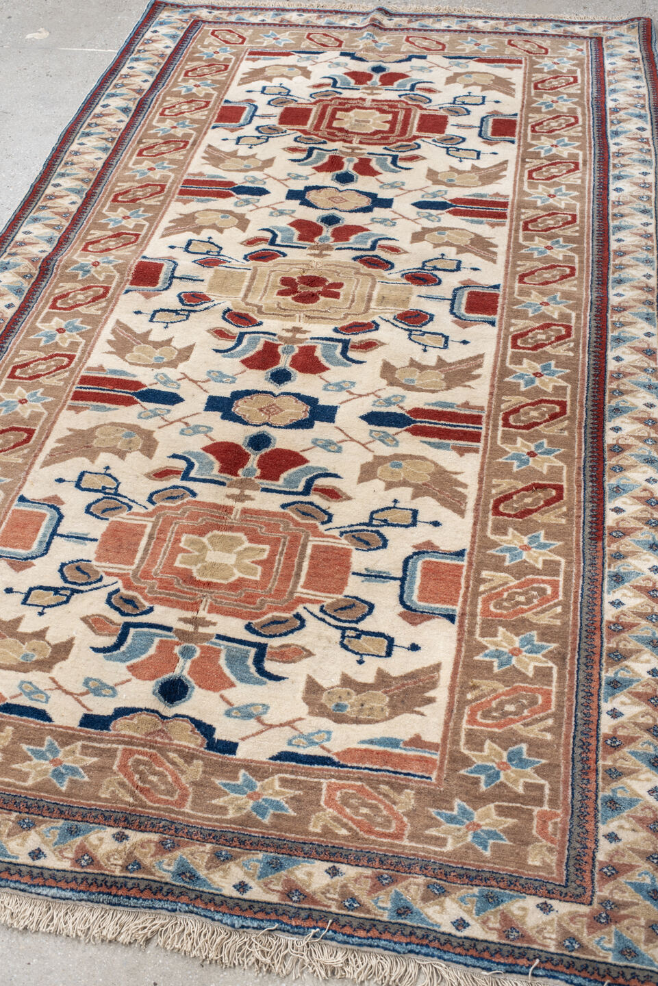 4' x 7' one-of-a-kind handmade vintage Ardebil rug. Color palette: ivory, camel, rust, sky blue, navy, taupe, terracotta
