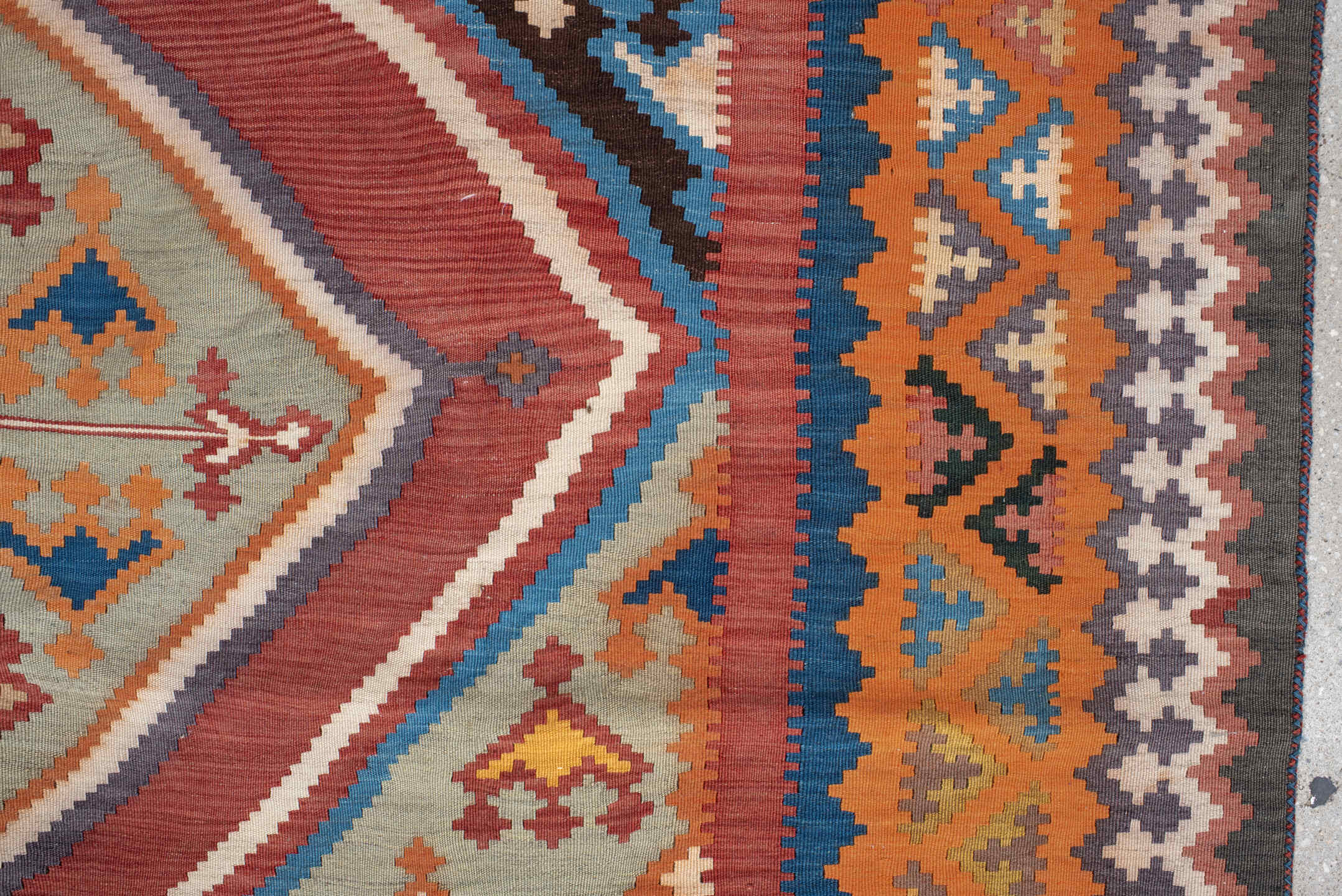 5' x 9' one-of-a-kind handmade vintage Kilim medium size rug. Color palette: terra cotta, ivory, teal, rust, brown, navy