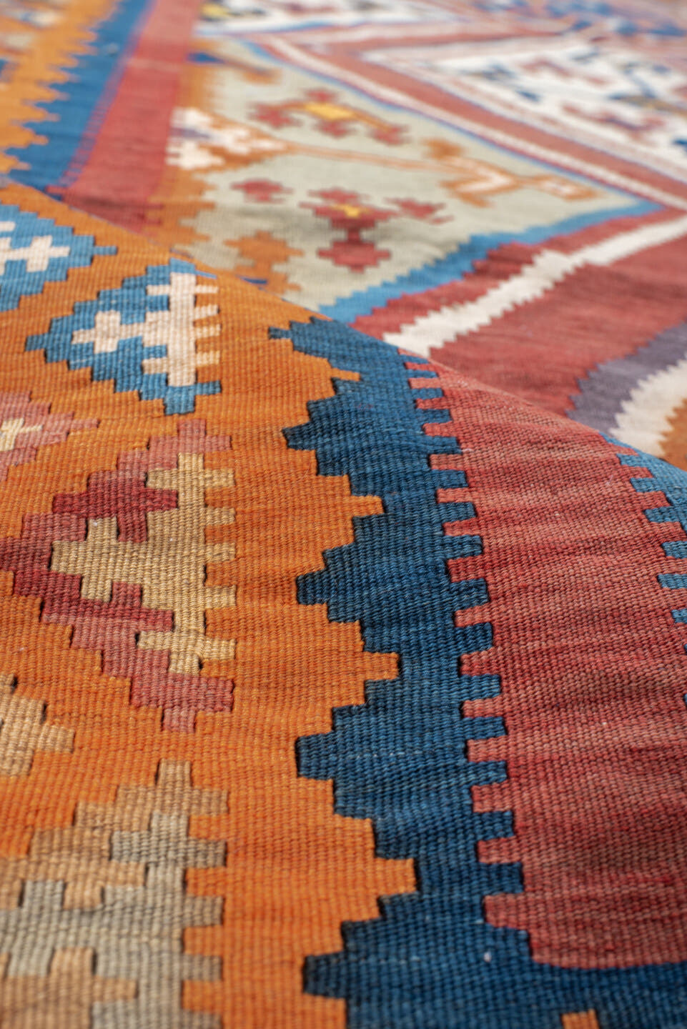 5' x 9' one-of-a-kind handmade vintage Kilim medium size rug. Color palette: terra cotta, ivory, teal, rust, brown, navy