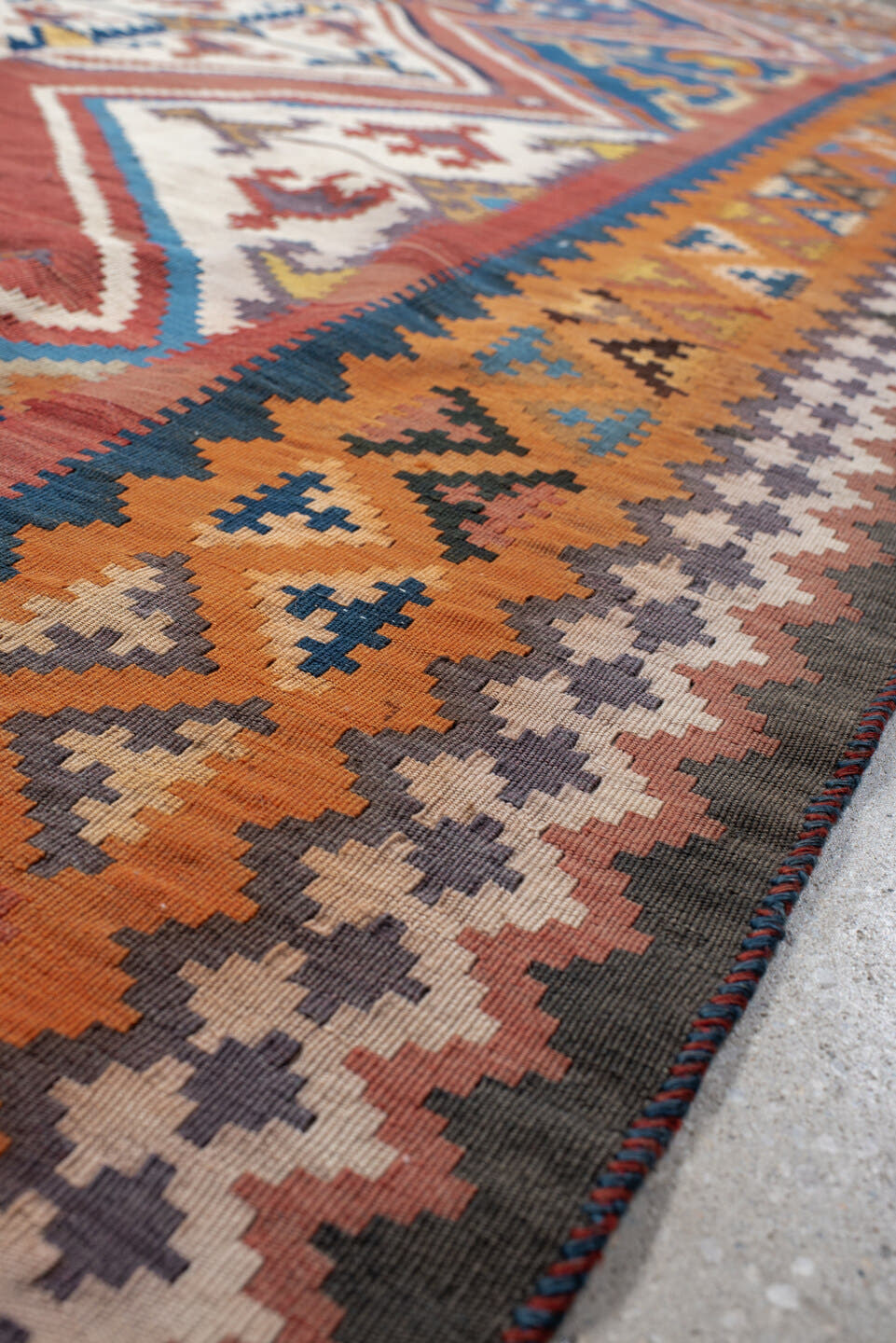 5' x 9' one-of-a-kind handmade vintage Kilim medium size rug. Color palette: terra cotta, ivory, teal, rust, brown, navy