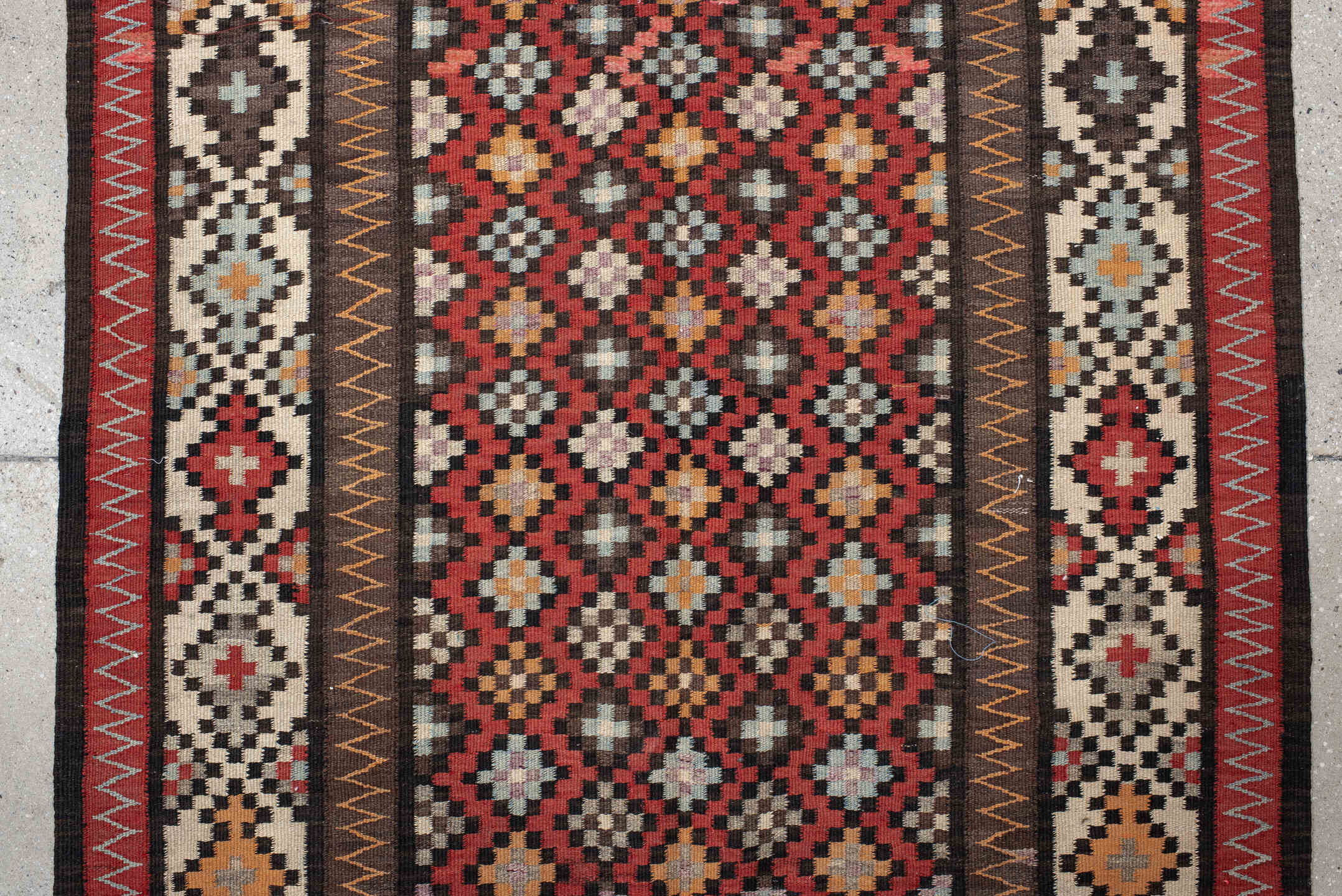 4' x 9' one-of-a-kind handmade vintage Kilim runner rug. Color palette: rust, ivory, charcoal, brown, sky blue, saffron
