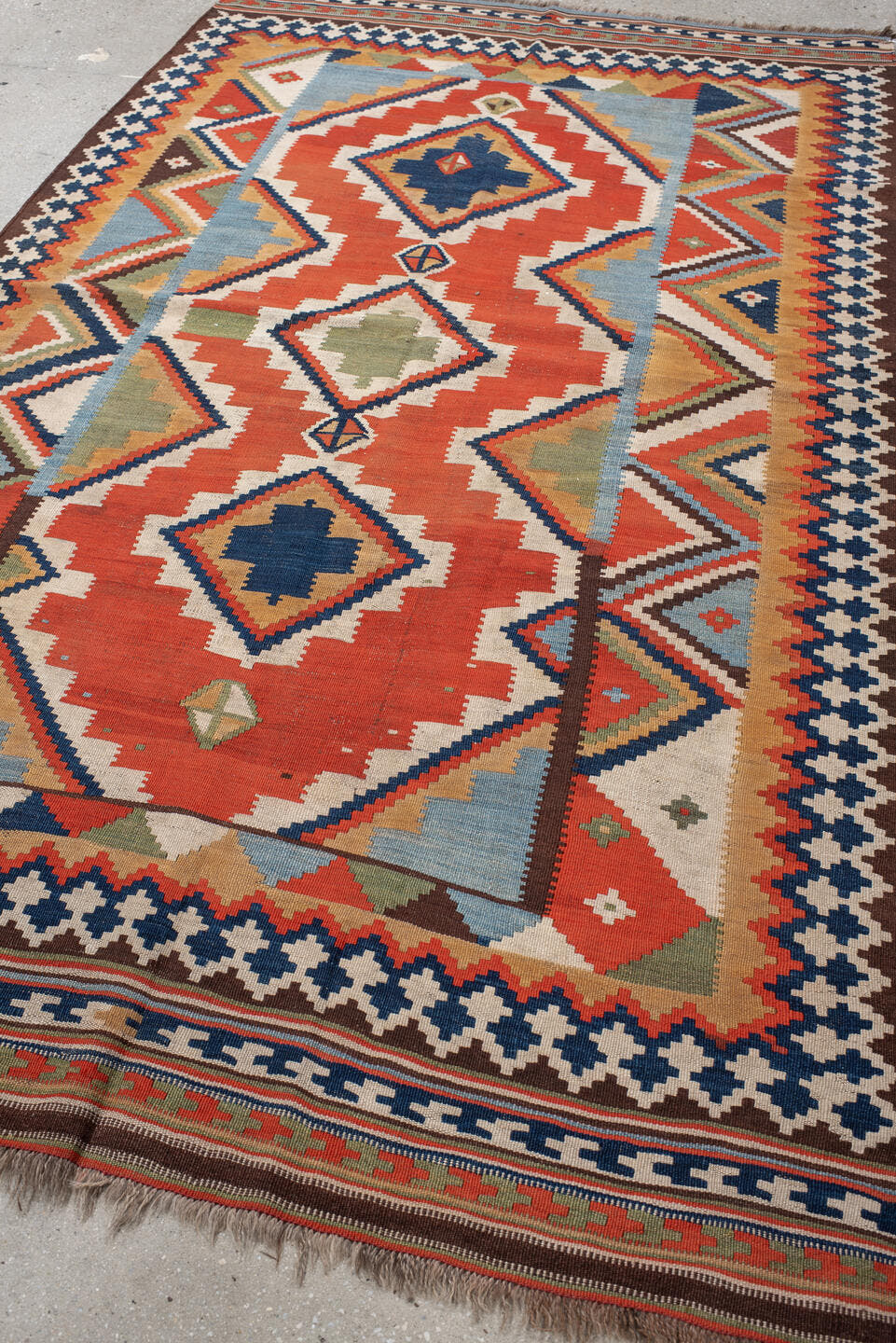 4' x 8' one-of-a-kind handmade vintage Kilim rug. Color palette: rust, ivory, sky_blue, navy, brown, camel, olive, coral