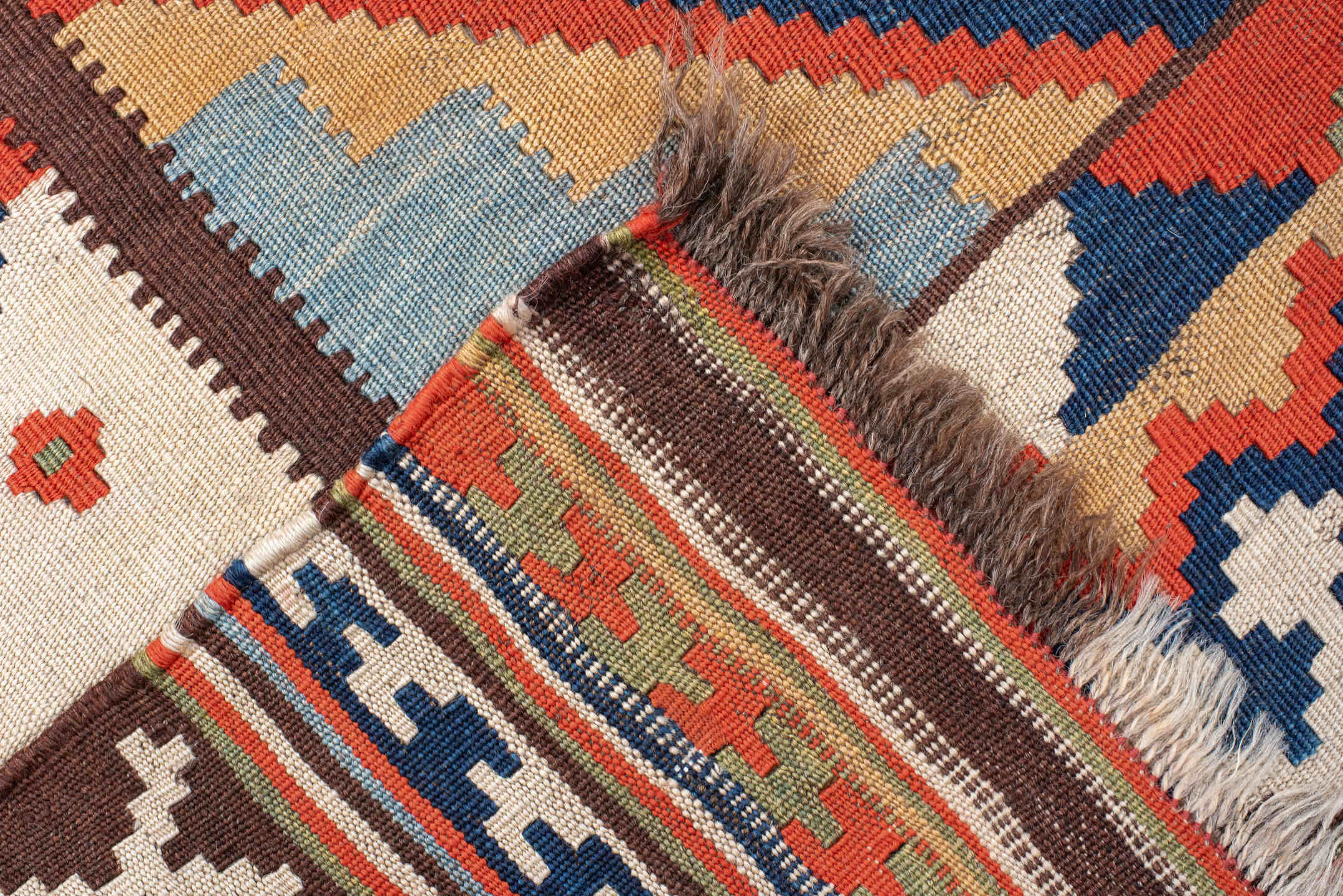 4' x 8' one-of-a-kind handmade vintage Kilim rug. Color palette: rust, ivory, sky_blue, navy, brown, camel, olive, coral
