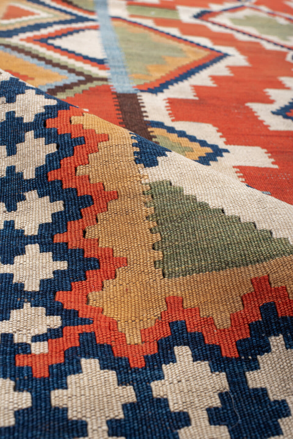 4' x 8' one-of-a-kind handmade vintage Kilim rug. Color palette: rust, ivory, sky_blue, navy, brown, camel, olive, coral