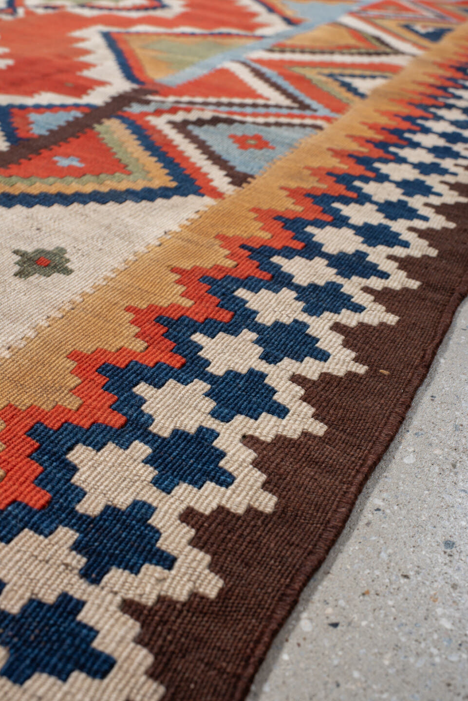 4' x 8' one-of-a-kind handmade vintage Kilim rug. Color palette: rust, ivory, sky_blue, navy, brown, camel, olive, coral