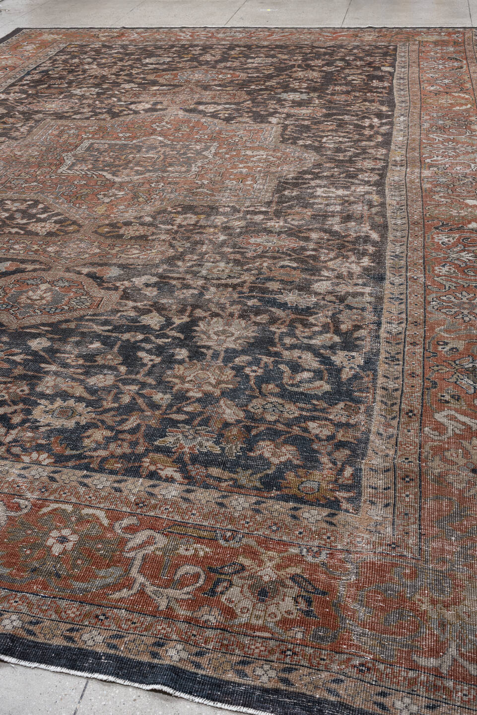 12' x 17' one-of-a-kind handmade antique Mahal oversize rug. Color palette: charcoal, rust, ivory, taupe, slate, camel, sage