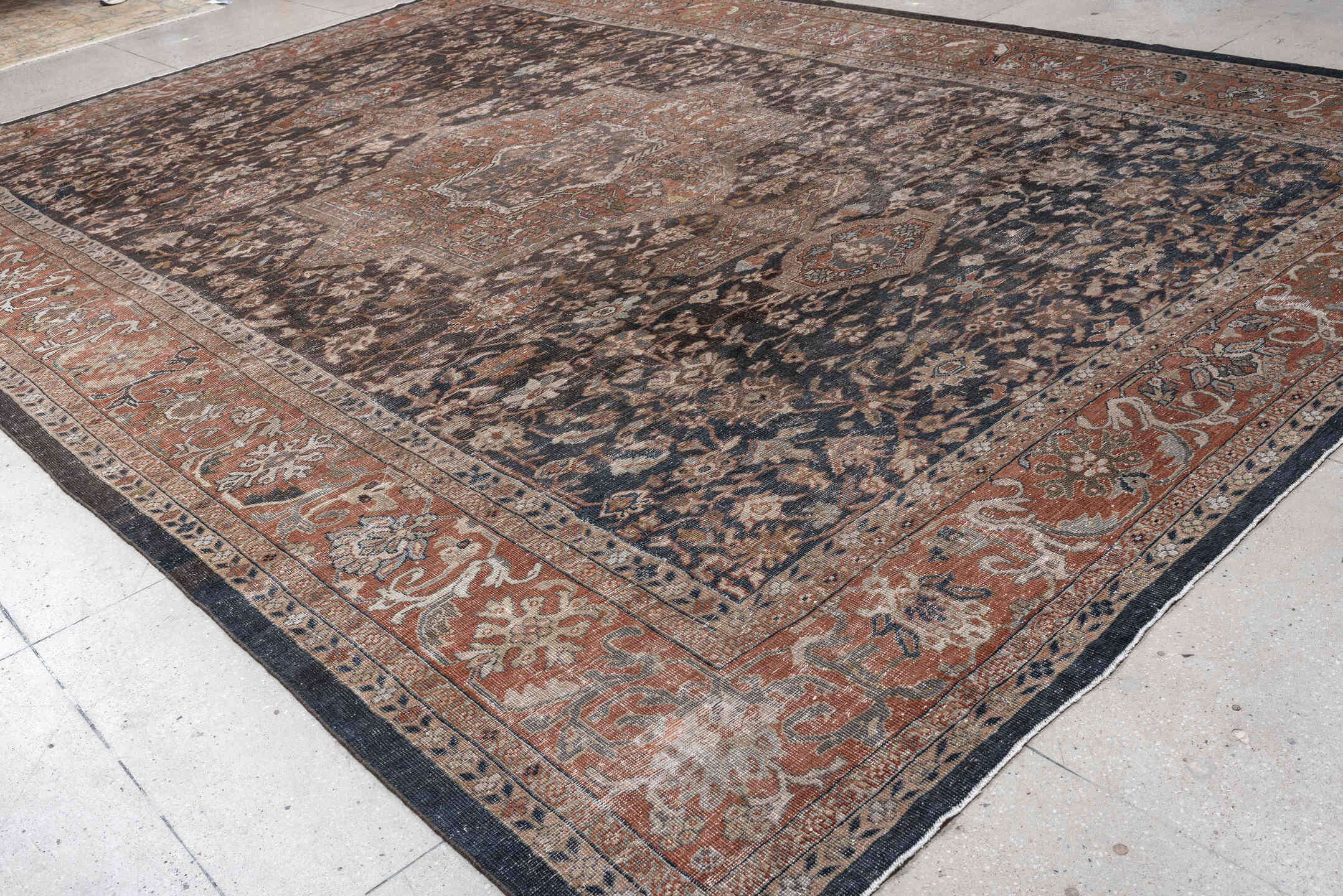 12' x 17' one-of-a-kind handmade antique Mahal oversize rug. Color palette: charcoal, rust, ivory, taupe, slate, camel, sage