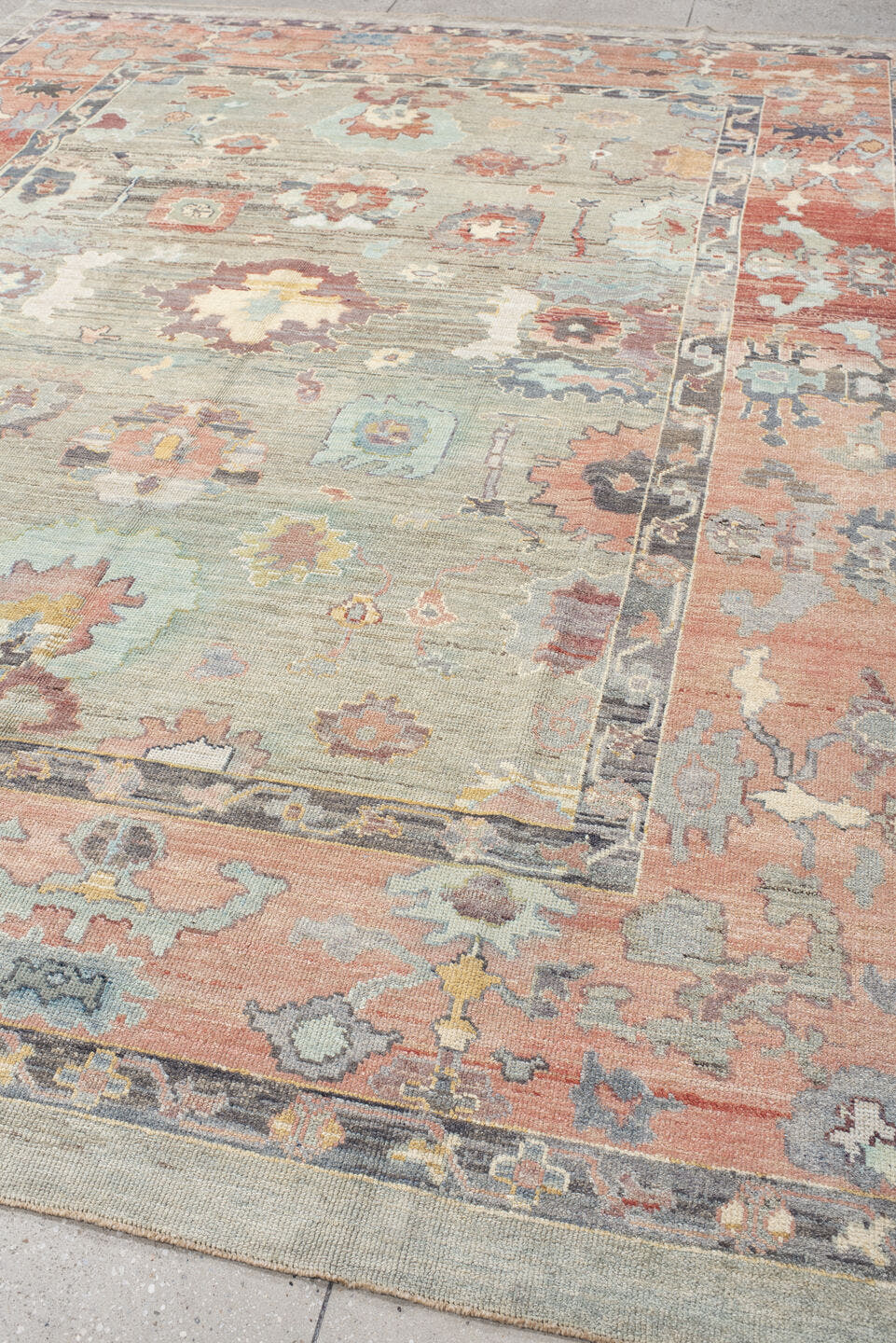 9' x 12' one-of-a-kind handmade vintage Oushak large size rug. Color palette: gray, salmon, aqua, slate, ivory, rust, taupe