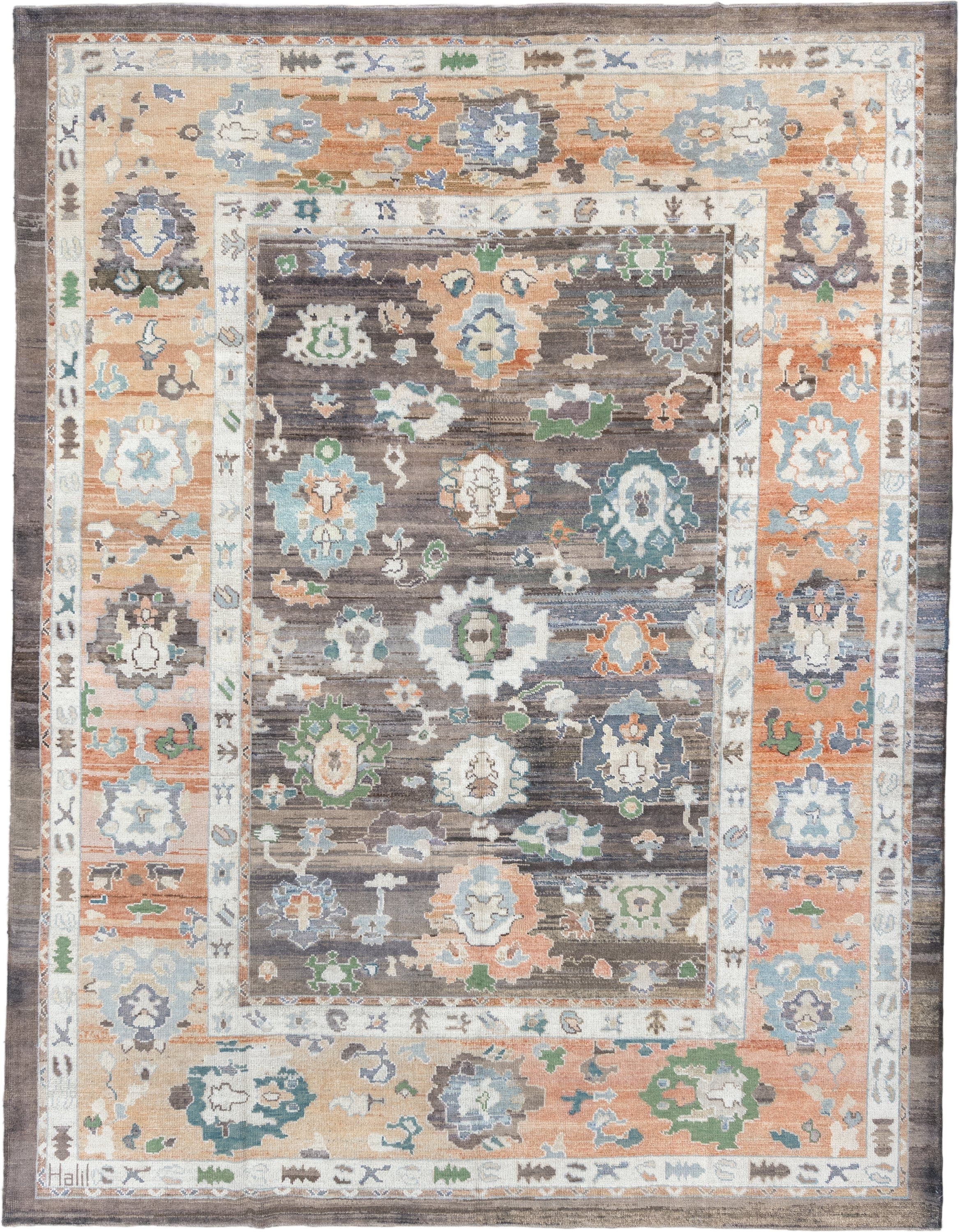9' x 11' one-of-a-kind handmade vintage Oushak large size rug. Color palette: charcoal, apricot, ivory, sky blue, sage