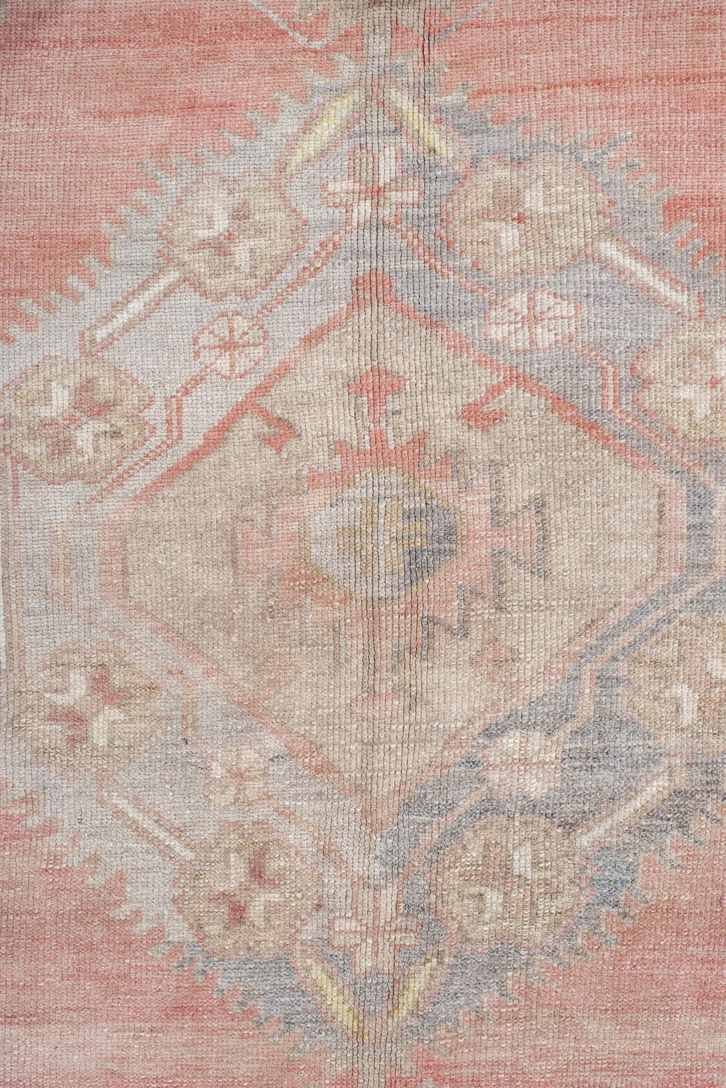5' x 9' one-of-a-kind handmade antique Anatolian medium size rug. Color palette: ivory, coral, taupe, slate, sage, ochre