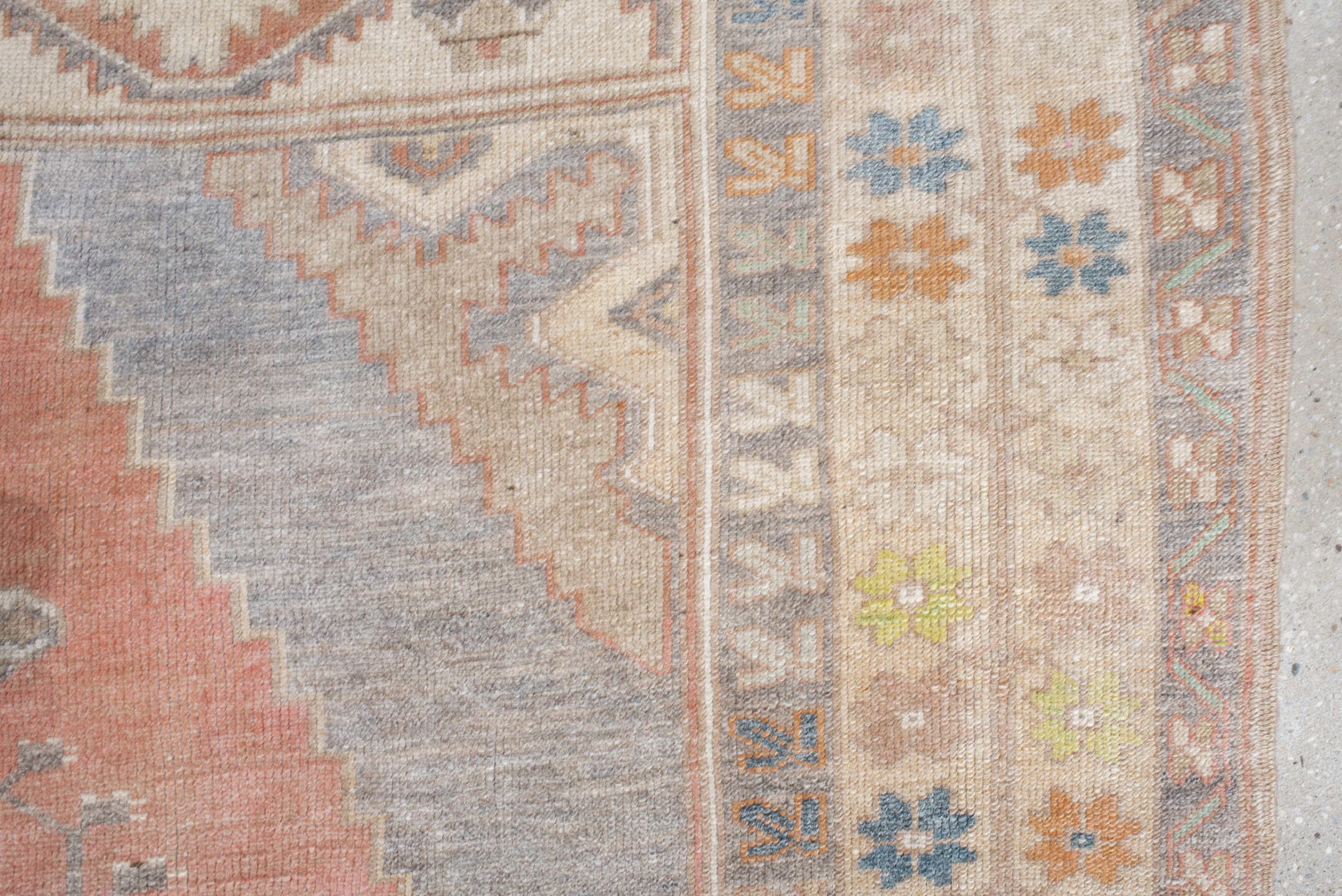 5' x 9' one-of-a-kind handmade antique Anatolian medium size rug. Color palette: ivory, coral, taupe, slate, sage, ochre