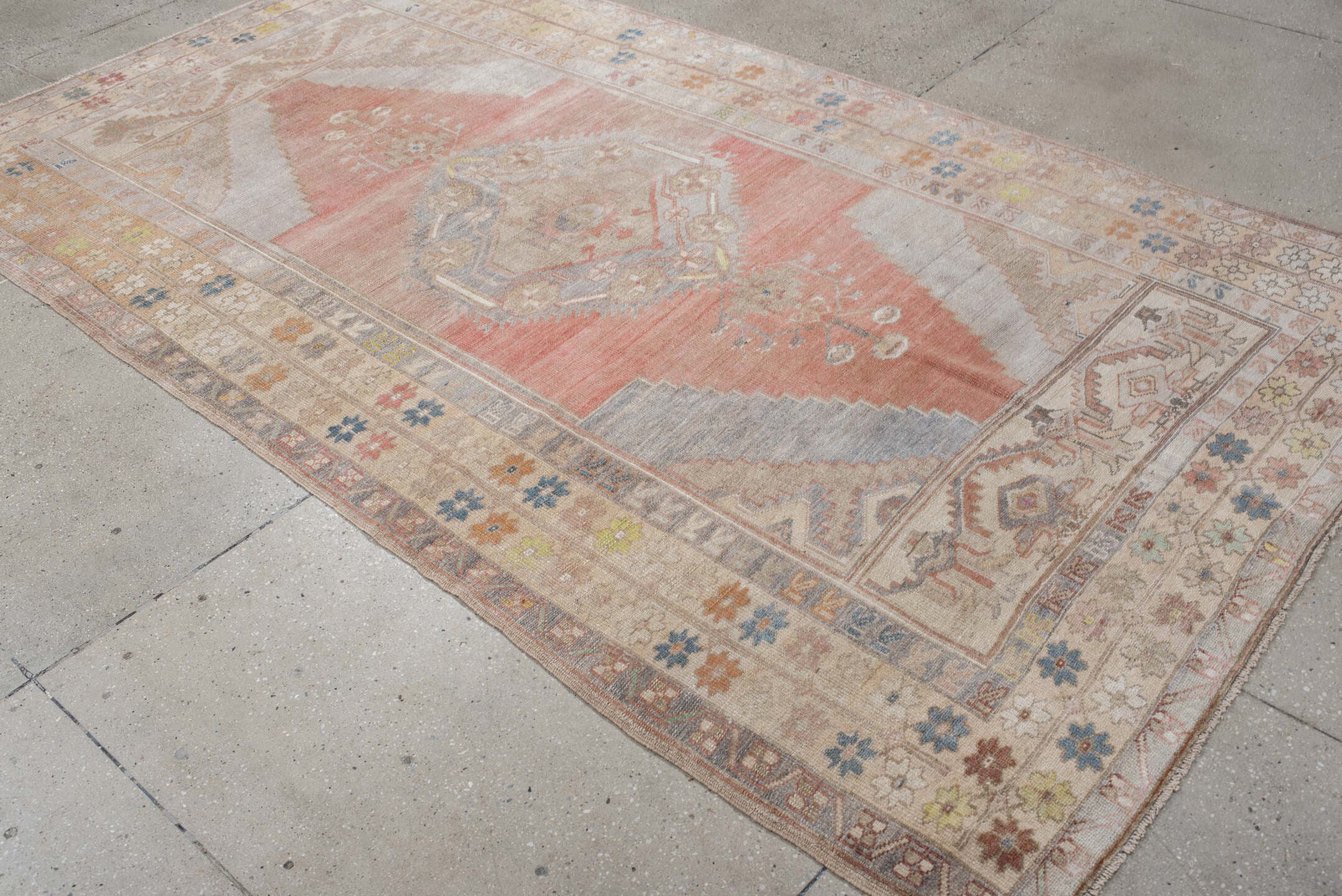 5' x 9' one-of-a-kind handmade antique Anatolian medium size rug. Color palette: ivory, coral, taupe, slate, sage, ochre