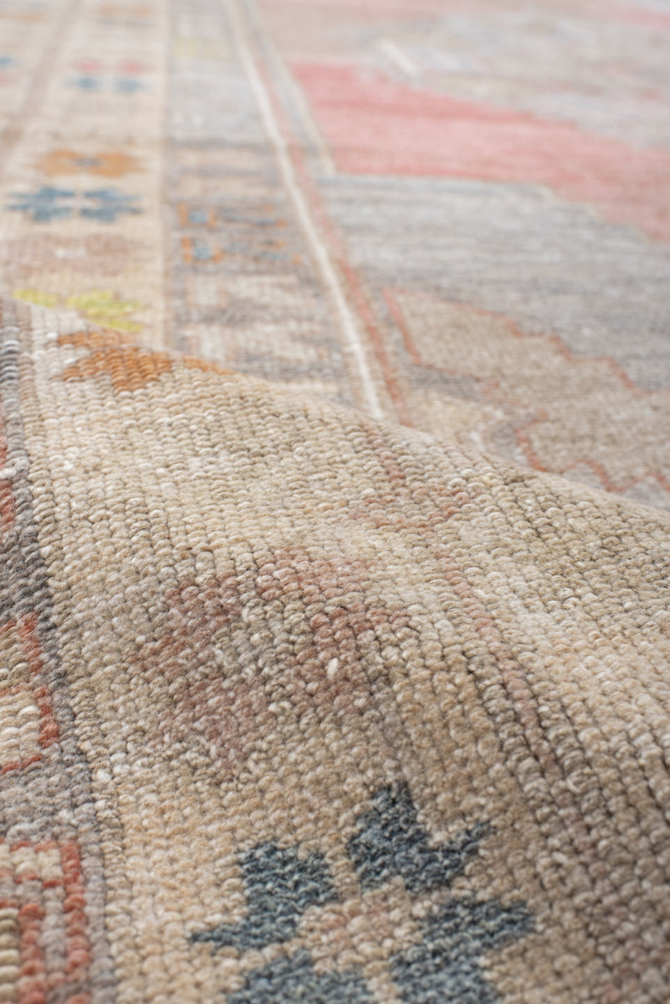 5' x 9' one-of-a-kind handmade antique Anatolian medium size rug. Color palette: ivory, coral, taupe, slate, sage, ochre