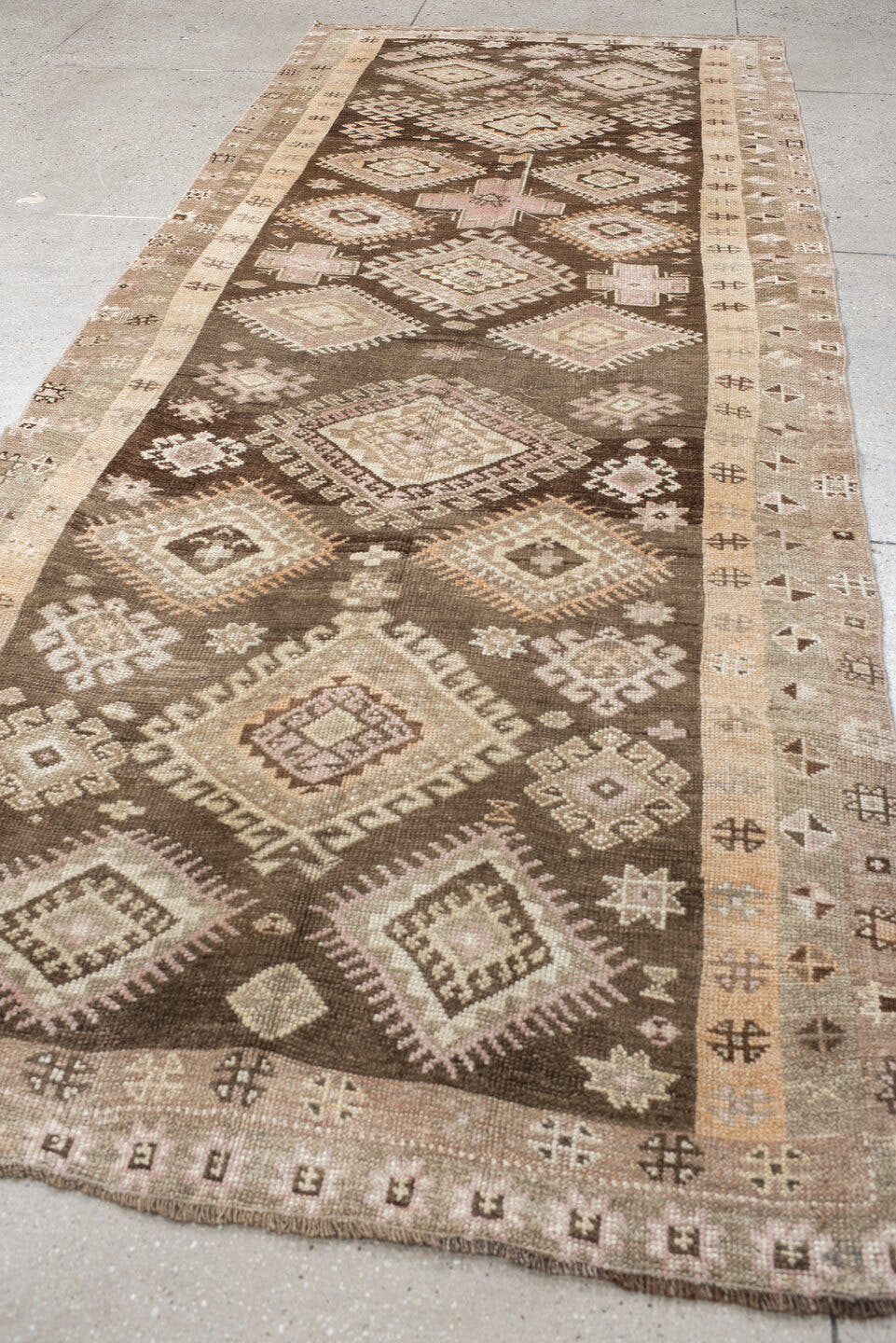 4' x 11' one-of-a-kind handmade vintage Kars runner rug. Color palette: brown, taupe, ivory, blush, beige, camel, charcoal