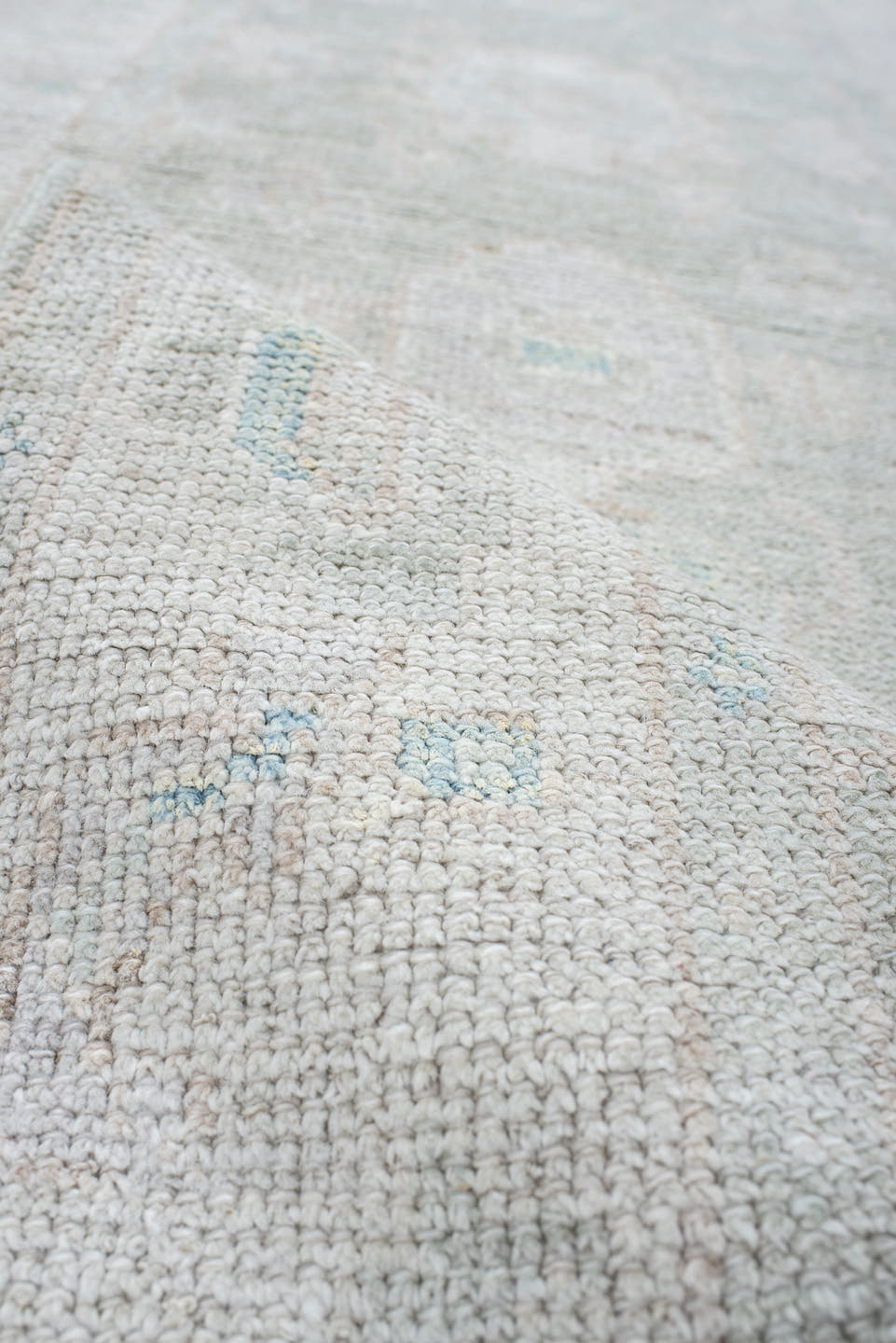 2' x 10' one-of-a-kind handmade vintage Oushak runner rug. Color palette: ivory, pale blue, cream, light gray, light blue