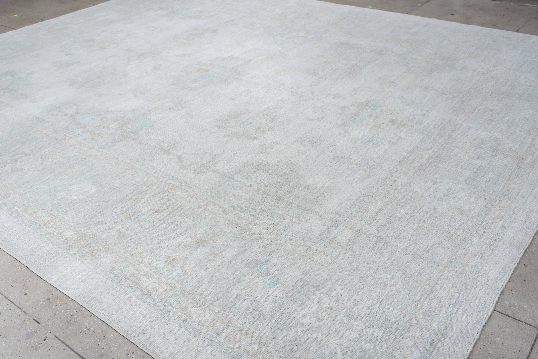 12' x 15' one-of-a-kind handmade vintage Oushak oversize rug. Color palette: ivory, pale blue, taupe, cream, sage