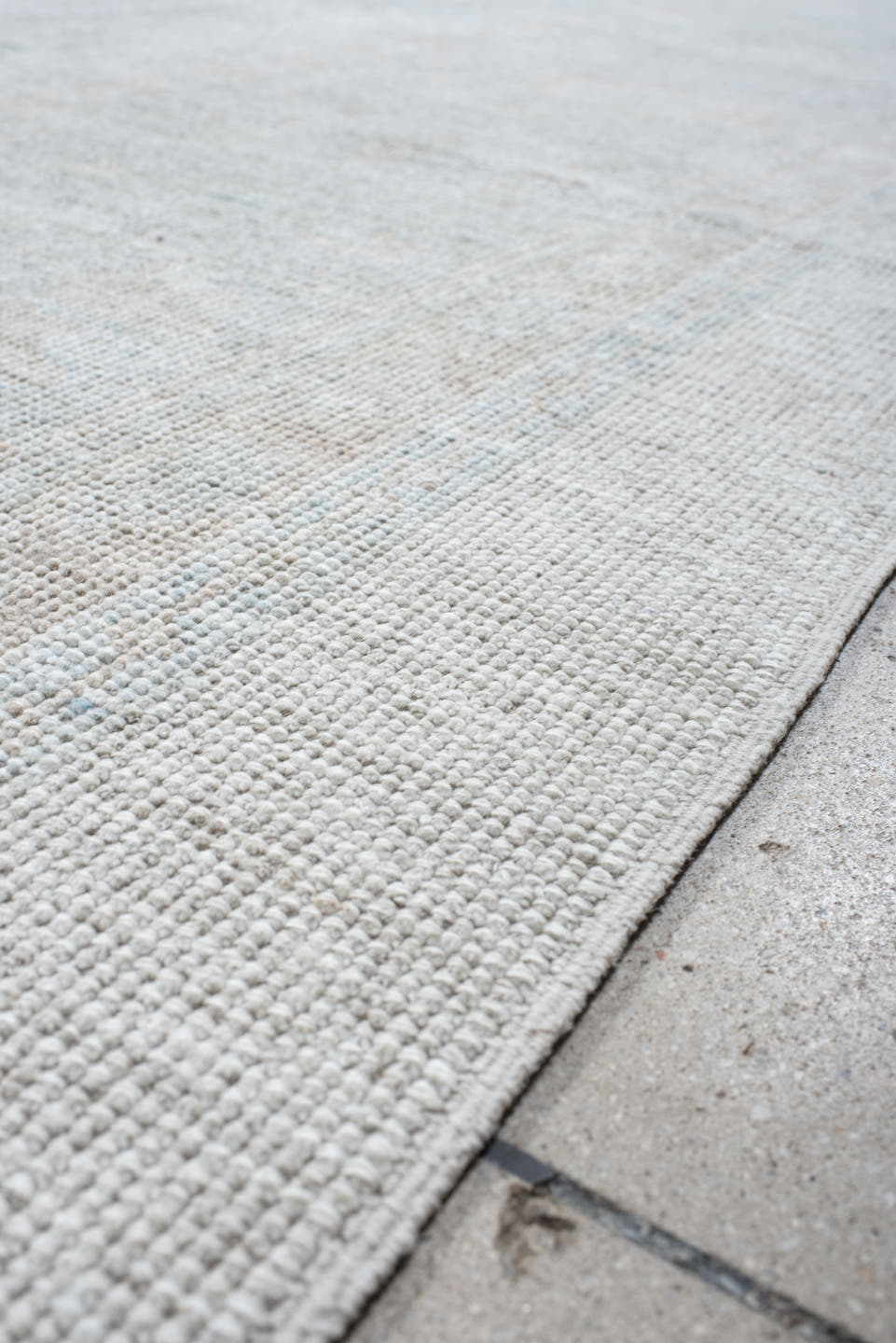 12' x 15' one-of-a-kind handmade vintage Oushak oversize rug. Color palette: ivory, pale blue, taupe, cream, sage