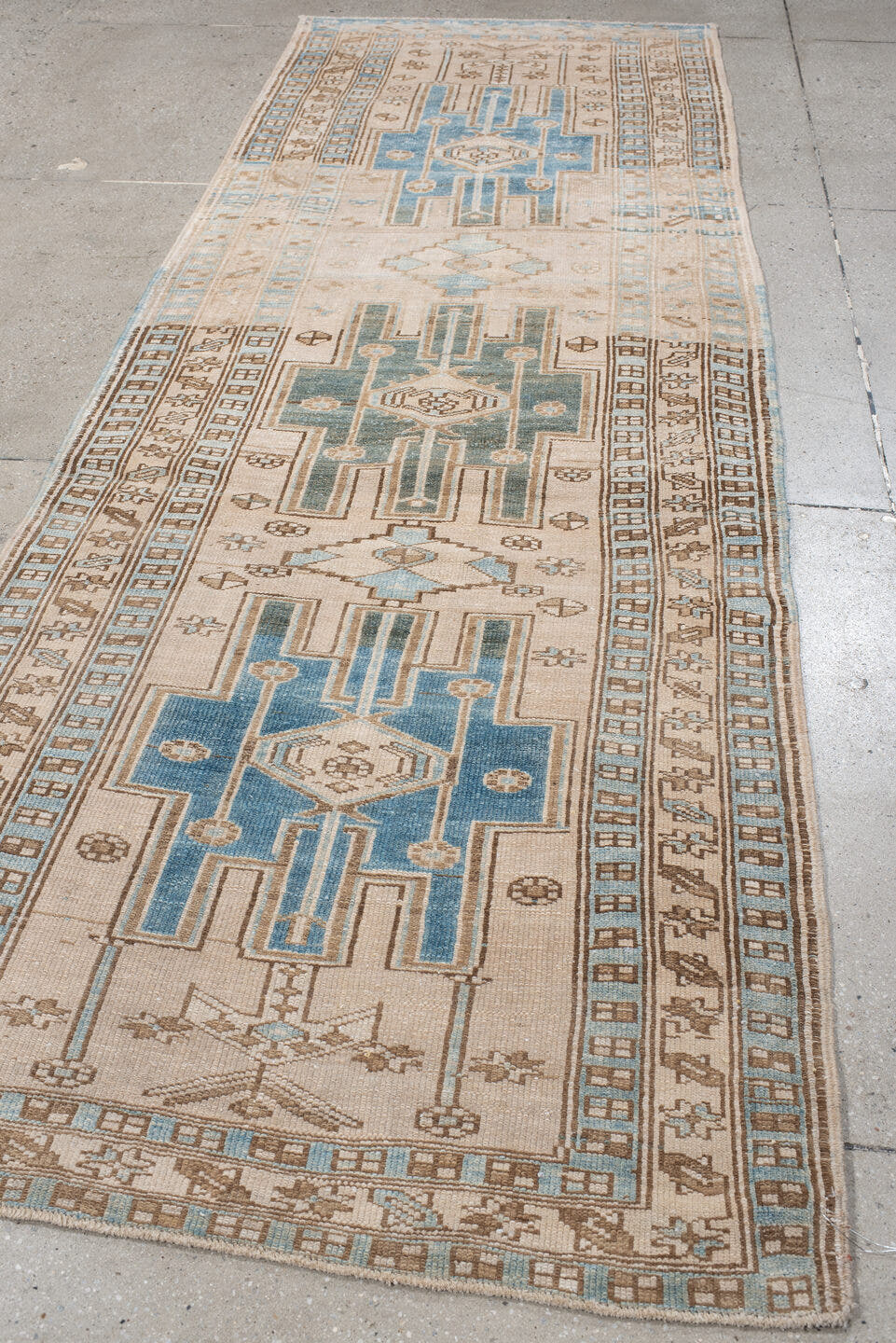 3' x 10' one-of-a-kind handmade antique Karaje runner rug. Color palette: ivory, sky blue, camel, taupe, brown, light blue