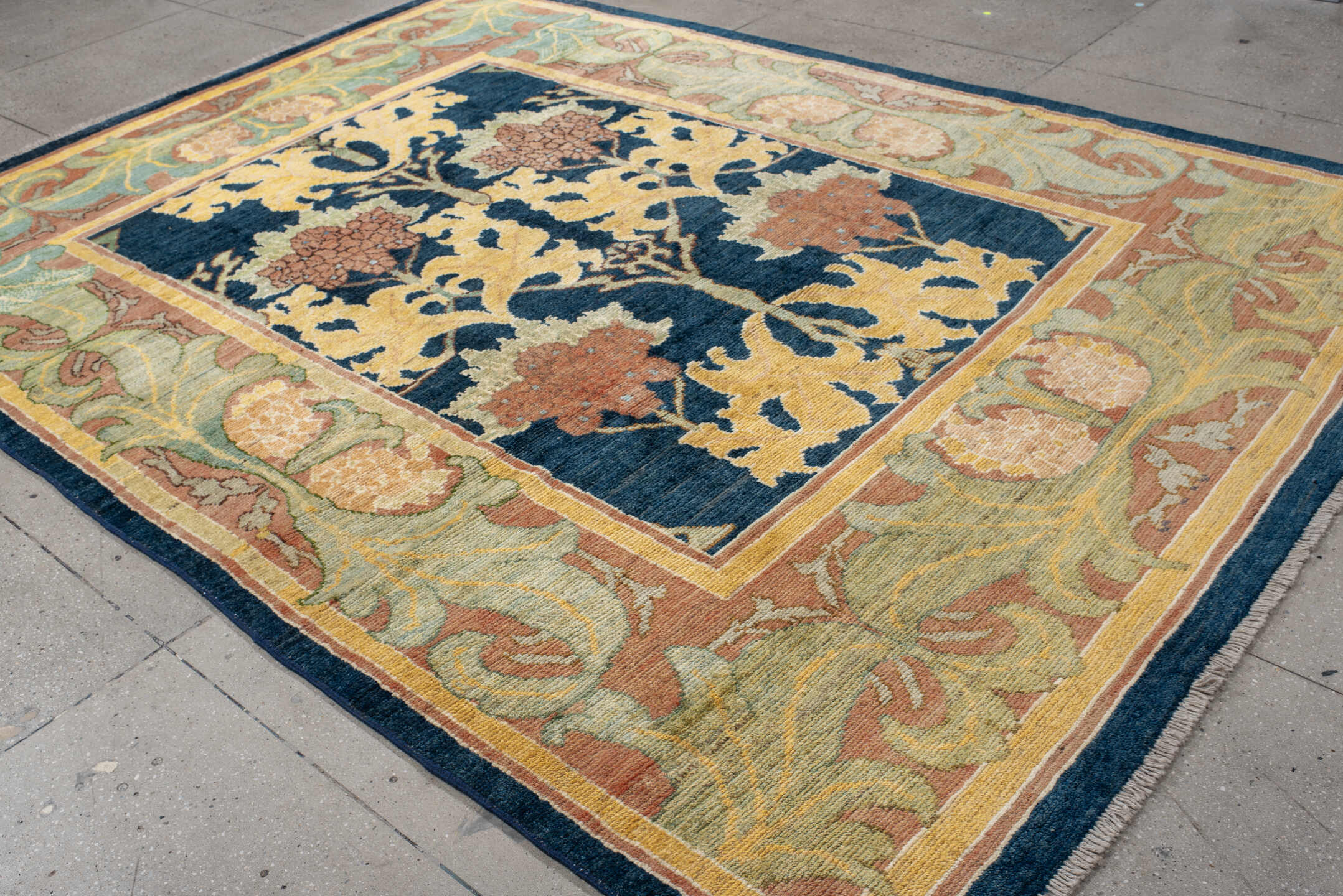8' x 11' one-of-a-kind handmade vintage Arts & Crafts large size rug. Color palette: navy, sage, gold, terra cotta, ivory