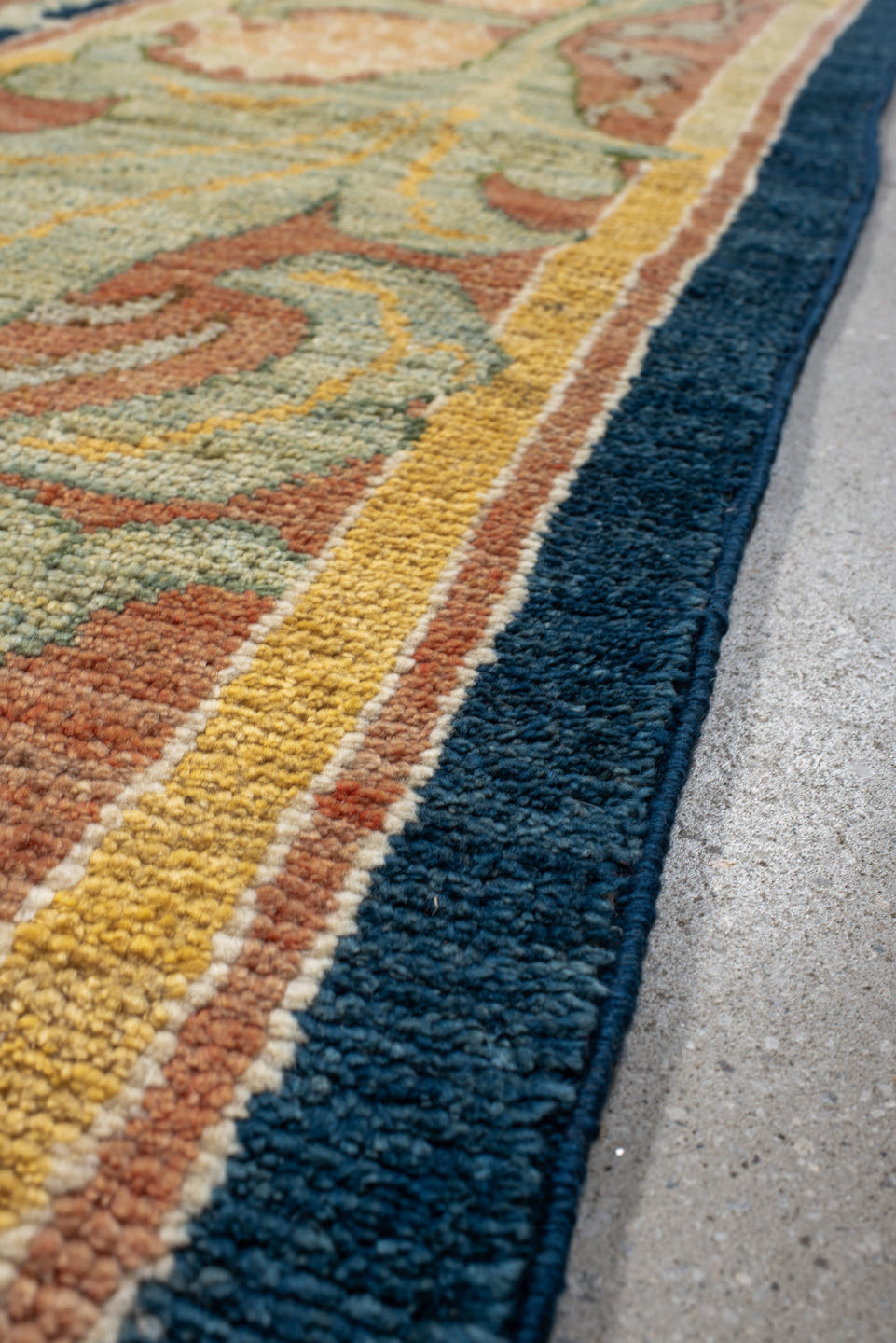 8' x 11' one-of-a-kind handmade vintage Arts & Crafts large size rug. Color palette: navy, sage, gold, terra cotta, ivory