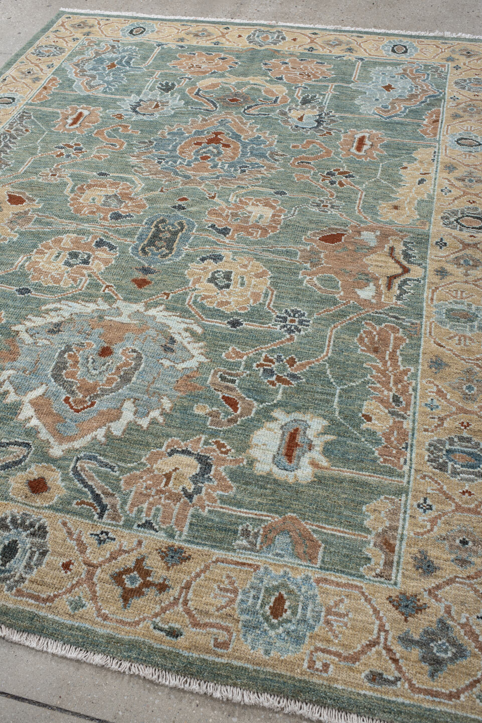 5' x 7' one-of-a-kind handmade vintage Sultanabad rug. Color palette: sage, ivory, peach, slate, rust, cream, charcoal