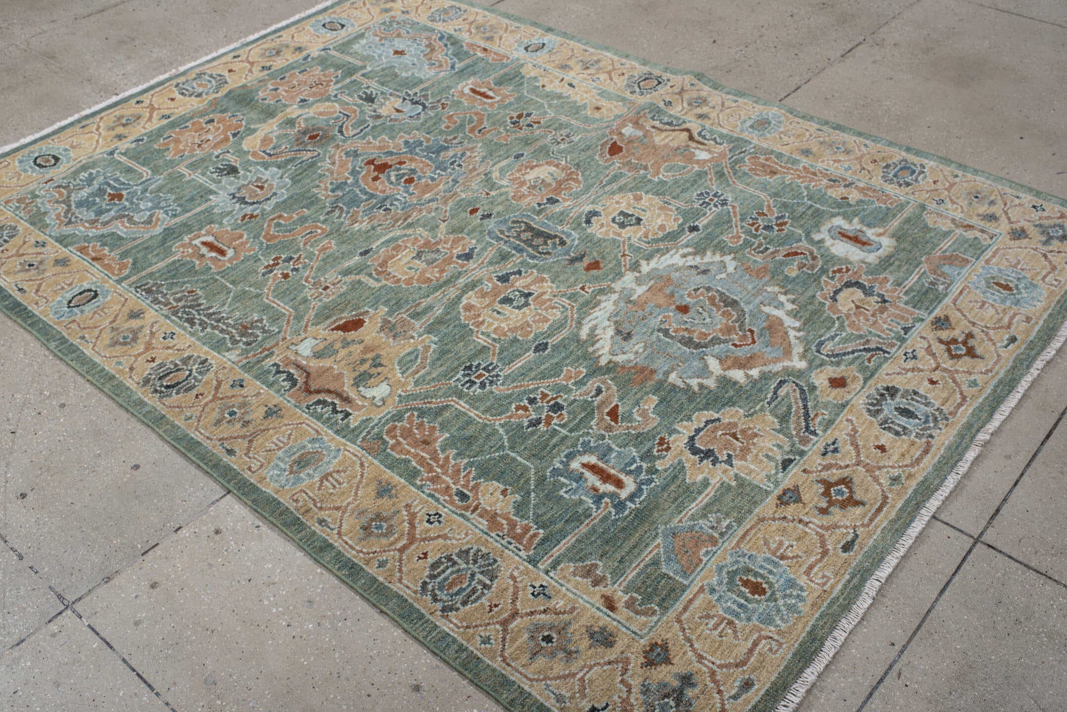 5' x 7' one-of-a-kind handmade vintage Sultanabad rug. Color palette: sage, ivory, peach, slate, rust, cream, charcoal