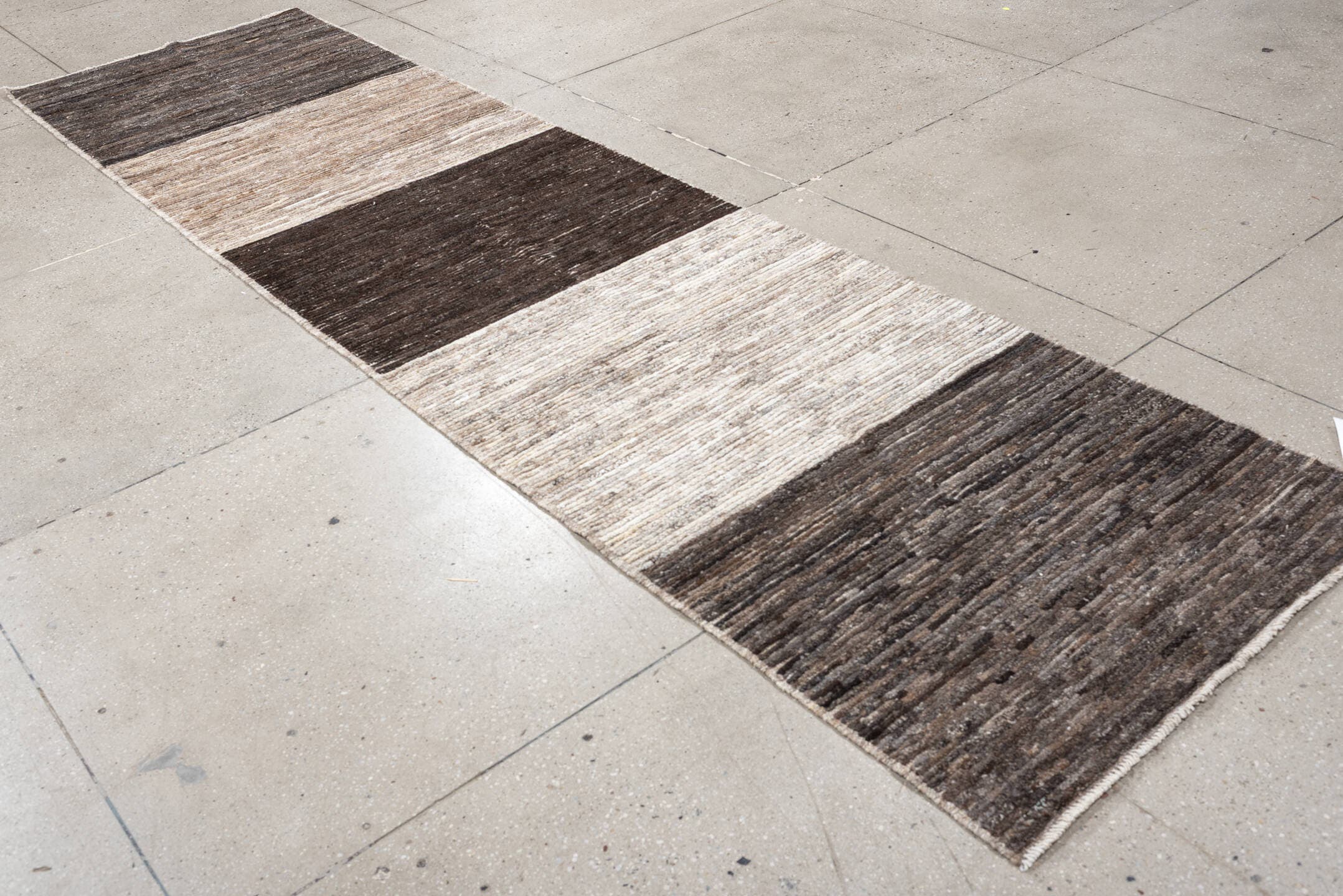 3' x 12' one-of-a-kind handmade vintage Tulu runner rug. Color palette: charcoal, taupe, ivory, brown, cream, slate, black