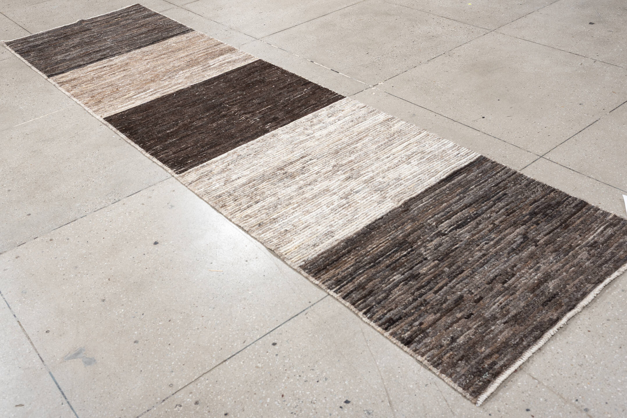 3' x 12' one-of-a-kind handmade vintage Tulu runner rug. Color palette: charcoal, taupe, ivory, brown, cream, slate, black