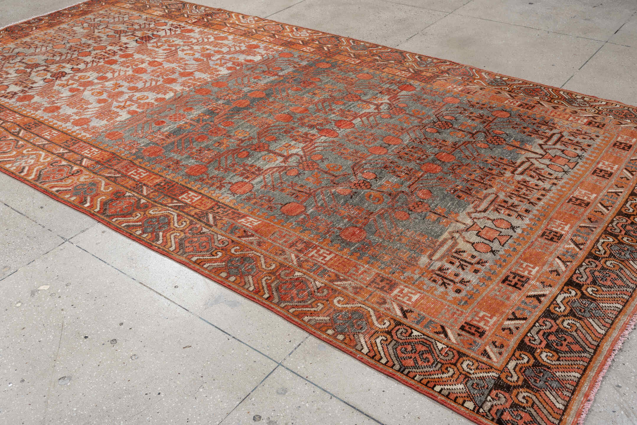 6' x 13' one-of-a-kind handmade antique Khotan large size rug. Color palette: slate, terra cotta, rust, ivory, charcoal