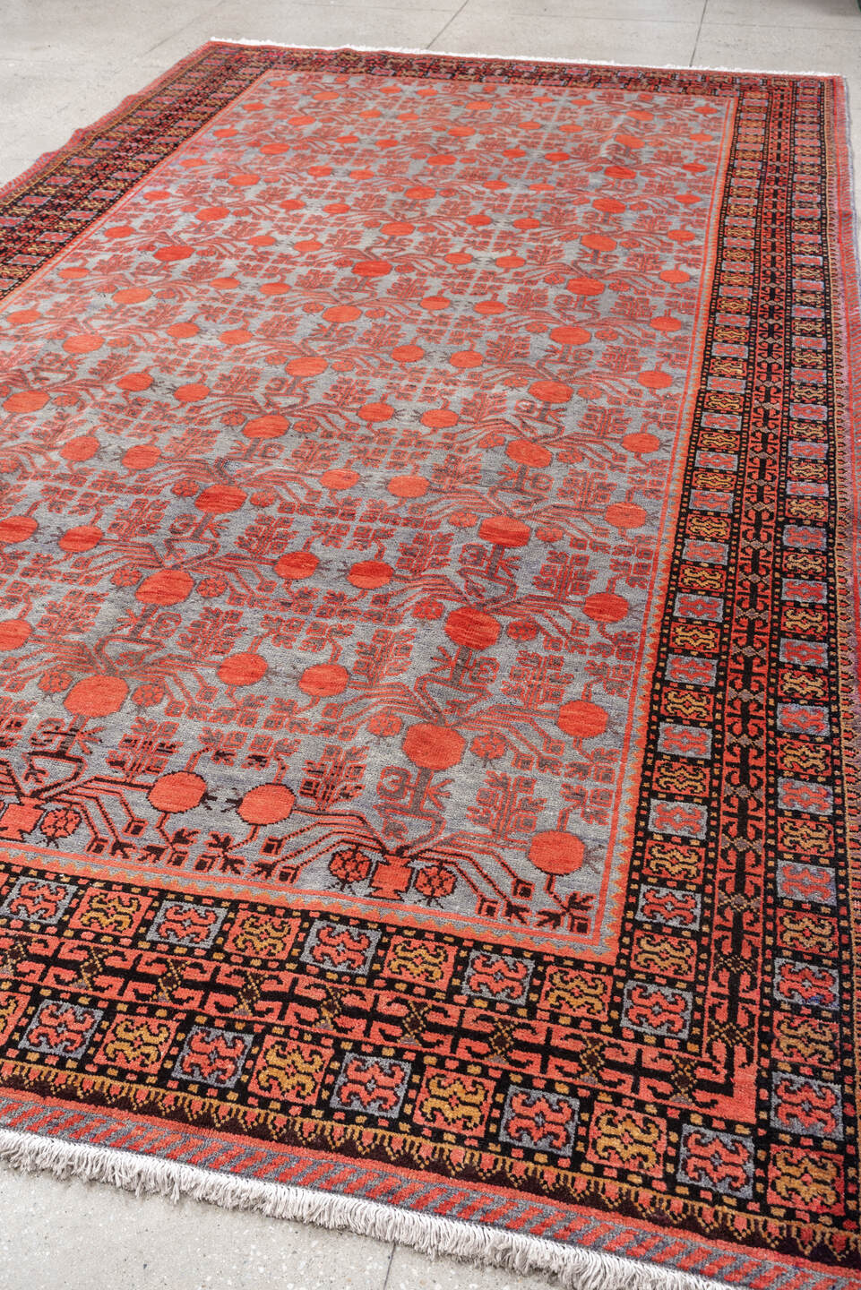7' x 13' one-of-a-kind handmade antique Khotan large size rug. Color palette: rose, terracotta, indigo, ivory, coral