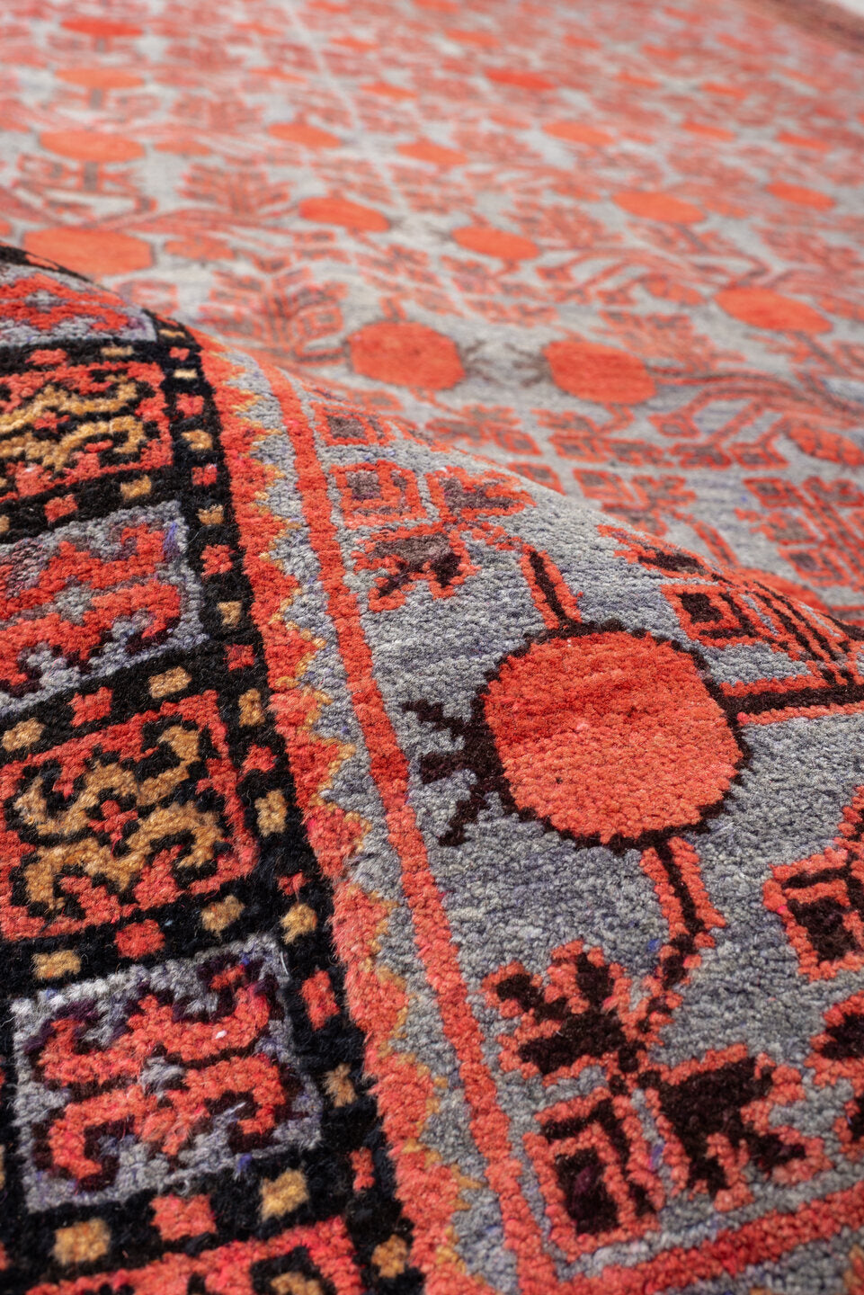 7' x 13' one-of-a-kind handmade antique Khotan large size rug. Color palette: rose, terracotta, indigo, ivory, coral