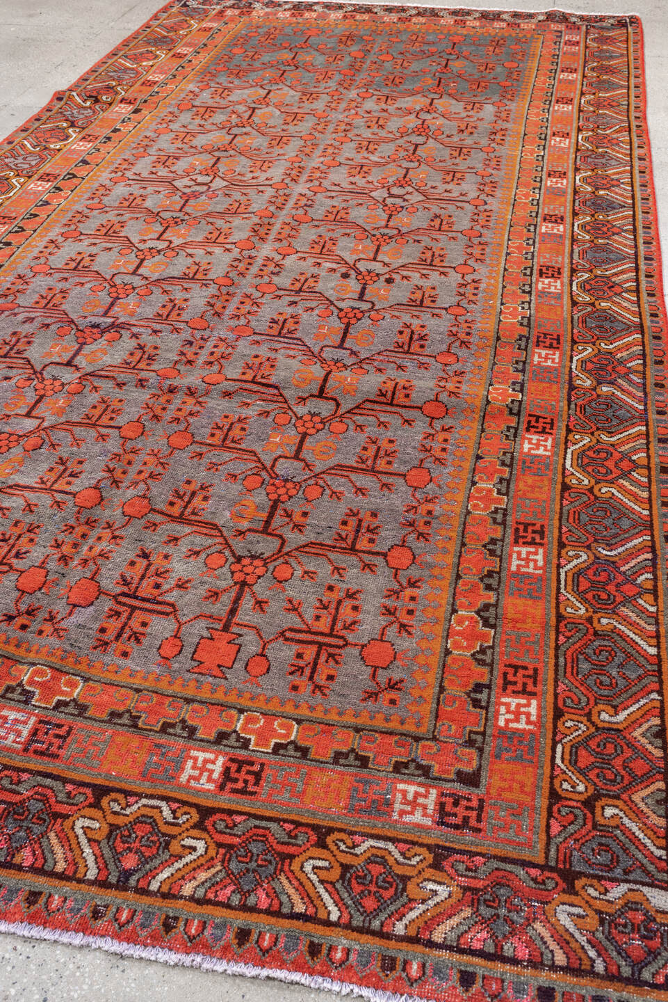 6' x 14' one-of-a-kind handmade antique Khotan large size rug. Color palette: slate, terracotta, rust, ivory, charcoal