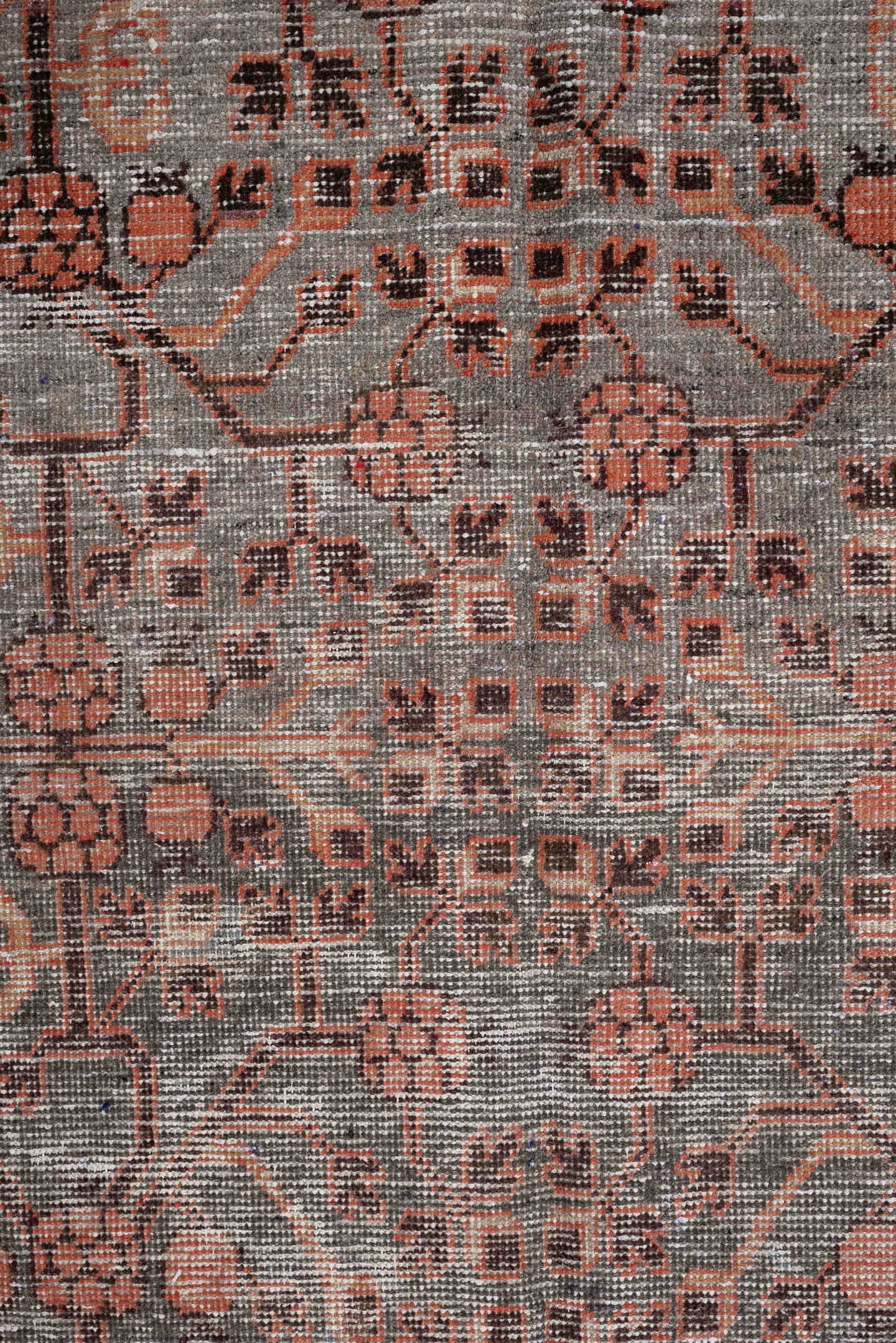 4' x 7' one-of-a-kind handmade antique  rug. Color palette: charcoal, coral, ivory, taupe, slate, terra cotta, brown, black