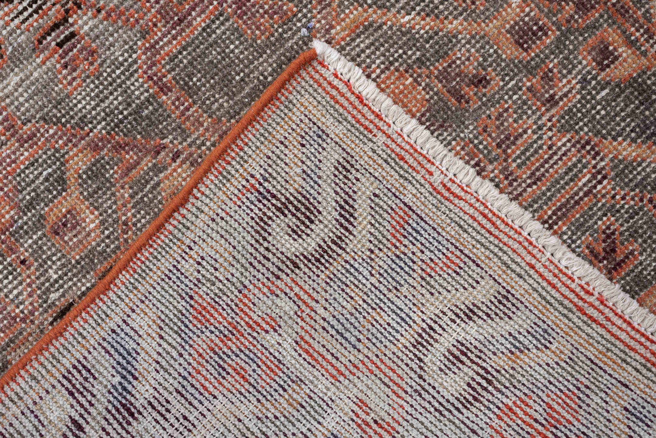 4' x 7' one-of-a-kind handmade antique  rug. Color palette: charcoal, coral, ivory, taupe, slate, terra cotta, brown, black