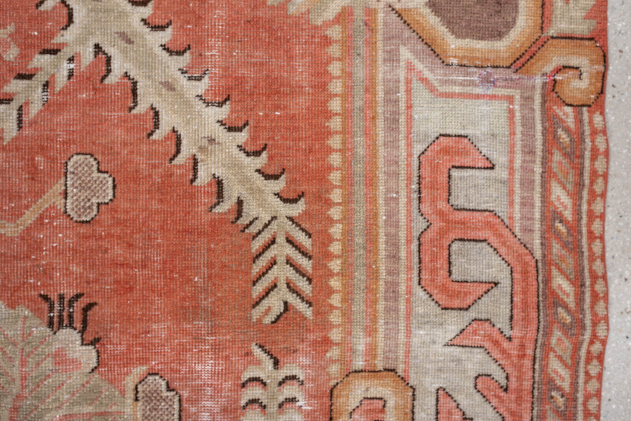 5' x 10' one-of-a-kind handmade antique Khotan large size rug. Color palette: coral, ivory, taupe, chocolate_brown, peach