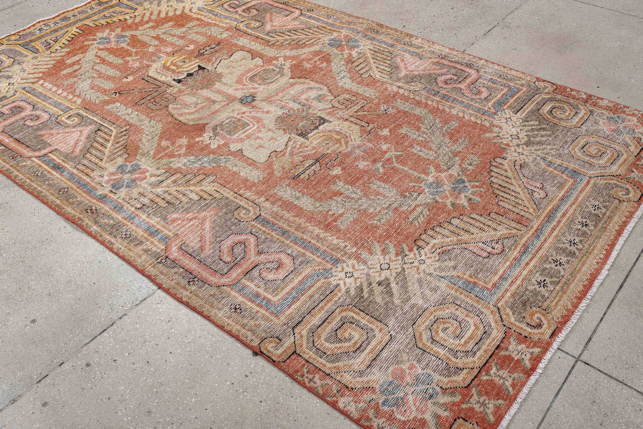 5' x 8' one-of-a-kind handmade vintage Khotan medium size rug. Color palette: terra cotta, ivory, taupe, slate, blush, camel