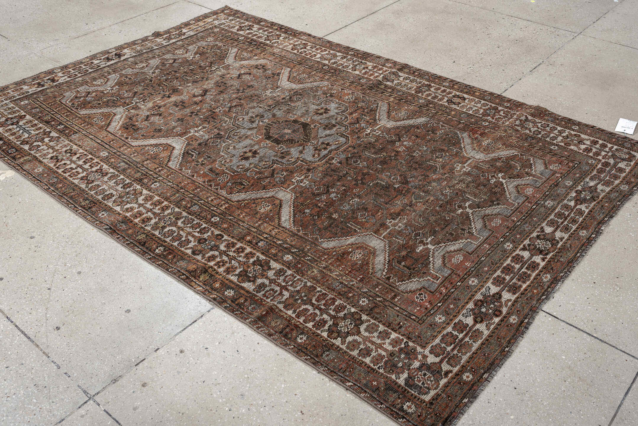 5' x 7' one-of-a-kind handmade antique Shiraz medium size rug. Color palette: rust, brown, ivory, taupe, charcoal, camel