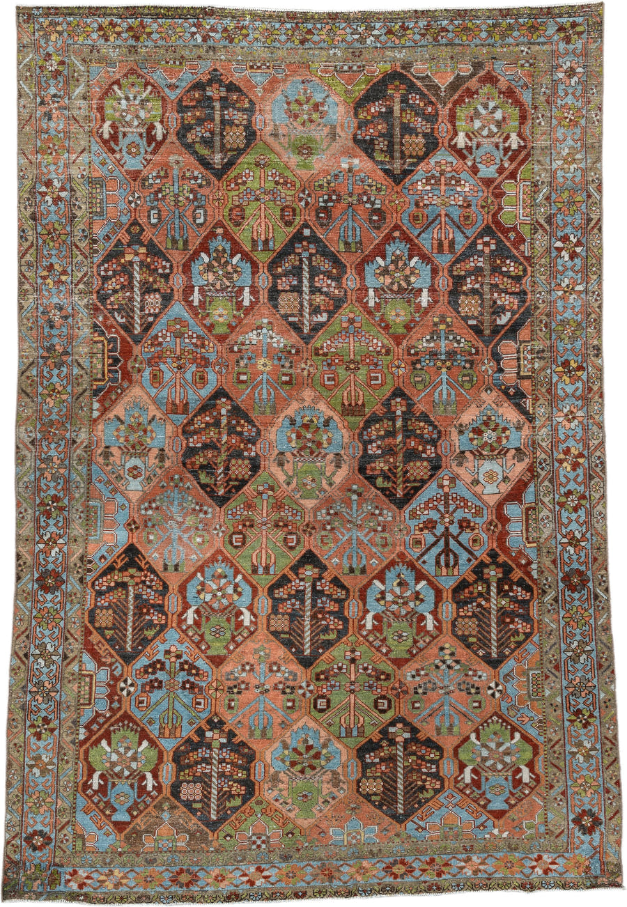 6' x 9' one-of-a-kind handmade antique Baktiary large size rug. Color palette: terra cotta, sky blue, olive, ivory, navy