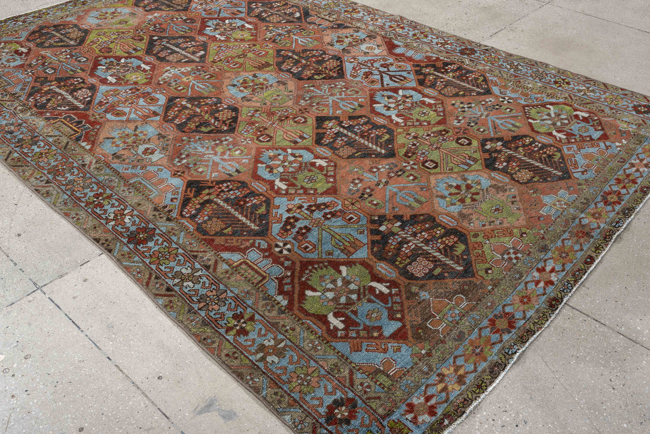 6' x 9' one-of-a-kind handmade antique Baktiary large size rug. Color palette: terra cotta, sky blue, olive, ivory, navy
