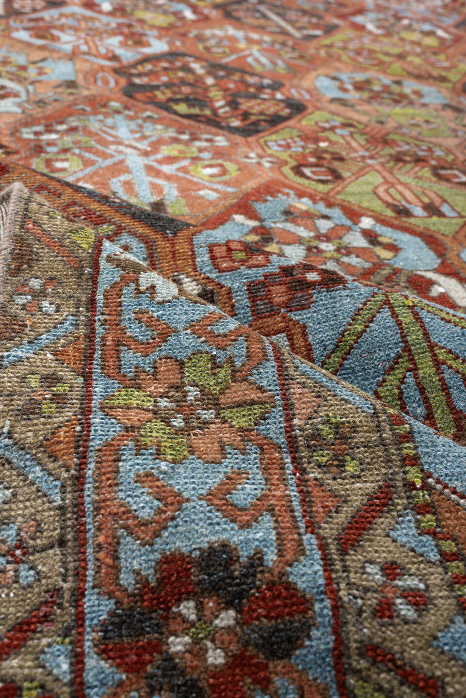 6' x 9' one-of-a-kind handmade antique Baktiary large size rug. Color palette: terra cotta, sky blue, olive, ivory, navy