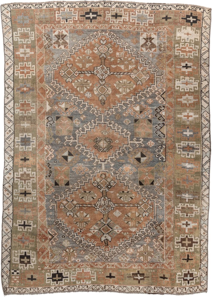 4' x 6' one-of-a-kind handmade antique Shiraz rug. Color palette: terra cotta, sage, ivory, charcoal, taupe, slate, camel
