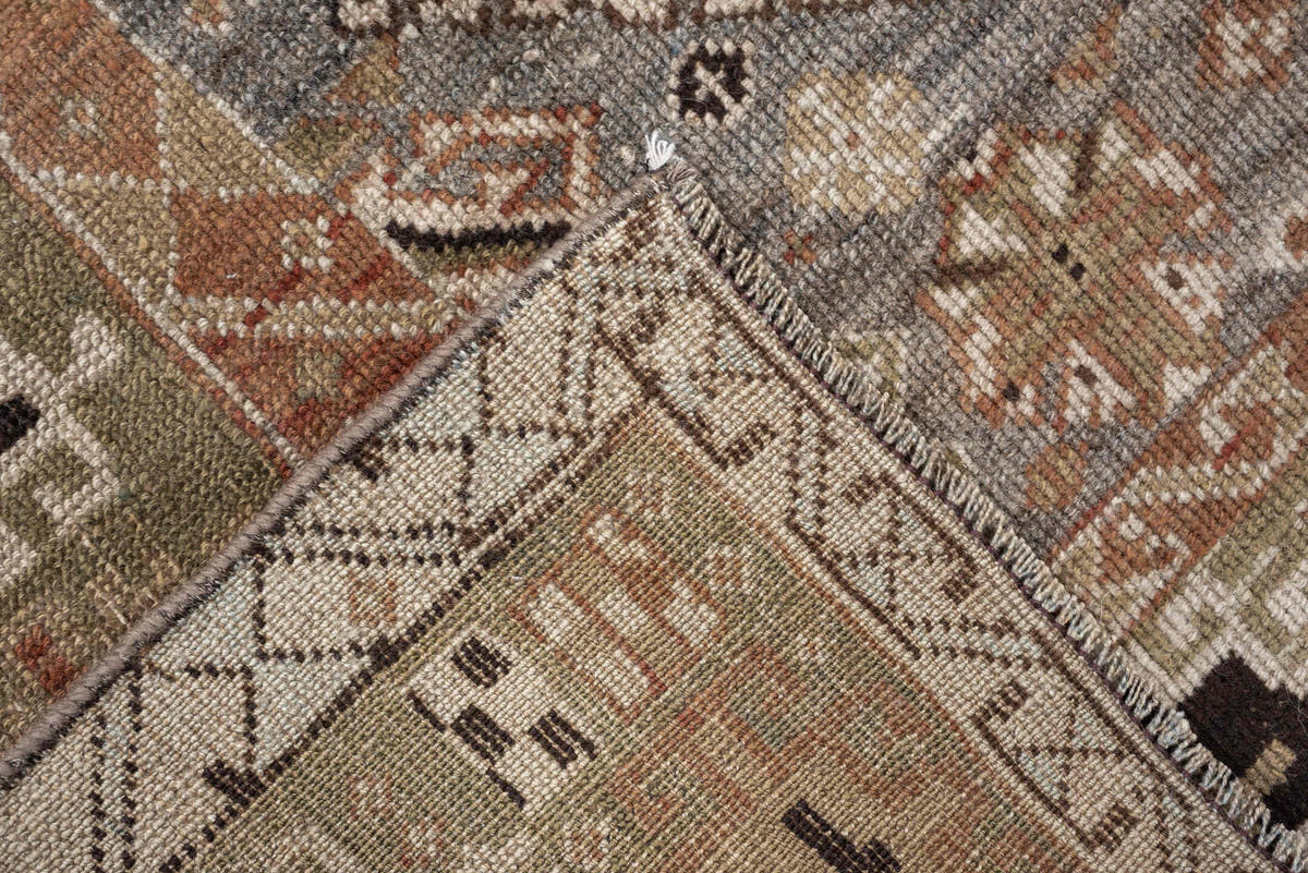 4' x 6' one-of-a-kind handmade antique Shiraz rug. Color palette: terra cotta, sage, ivory, charcoal, taupe, slate, camel