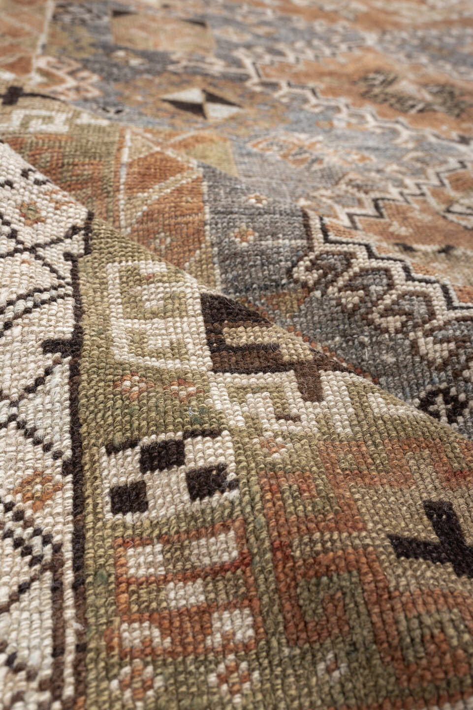 4' x 6' one-of-a-kind handmade antique Shiraz rug. Color palette: terra cotta, sage, ivory, charcoal, taupe, slate, camel