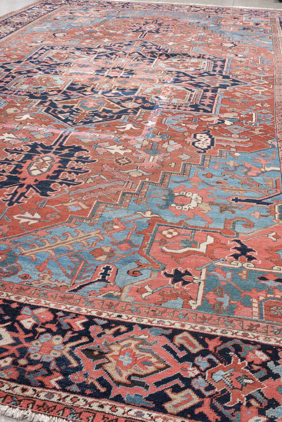 11' x 16' one-of-a-kind handmade vintage Heriz oversize rug. Color palette: terra cotta, navy, sky blue, ivory, rose, slate