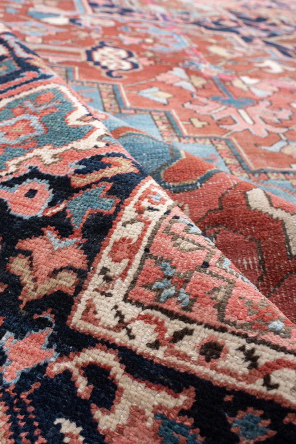 11' x 16' one-of-a-kind handmade vintage Heriz oversize rug. Color palette: terra cotta, navy, sky blue, ivory, rose, slate